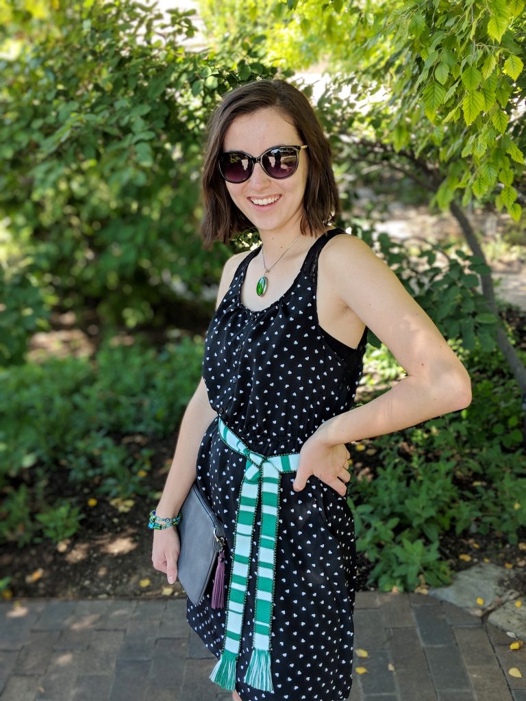 black heart print dress, green belt, green necklace