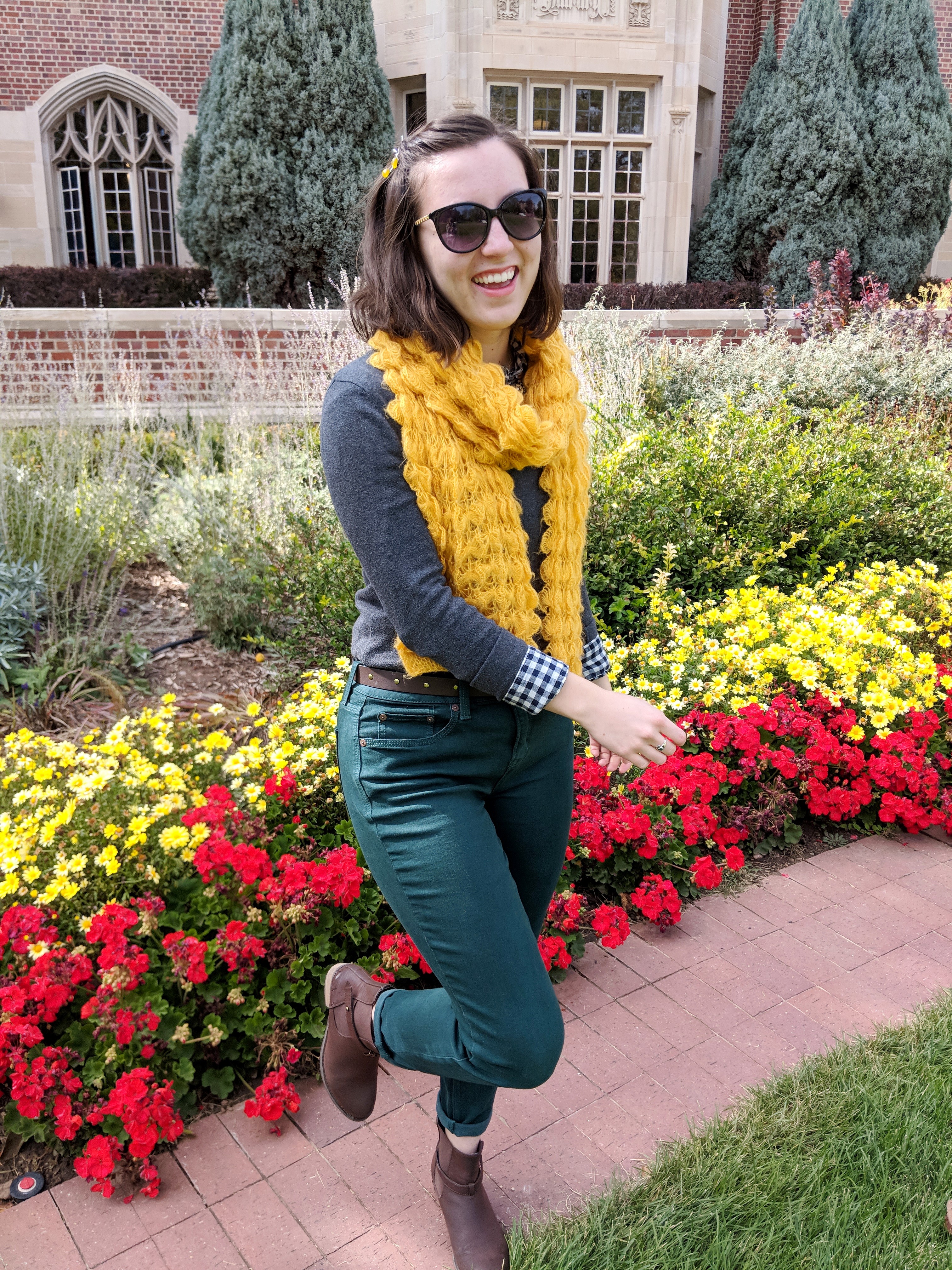 grey sweater, yellow scarf, green jeans