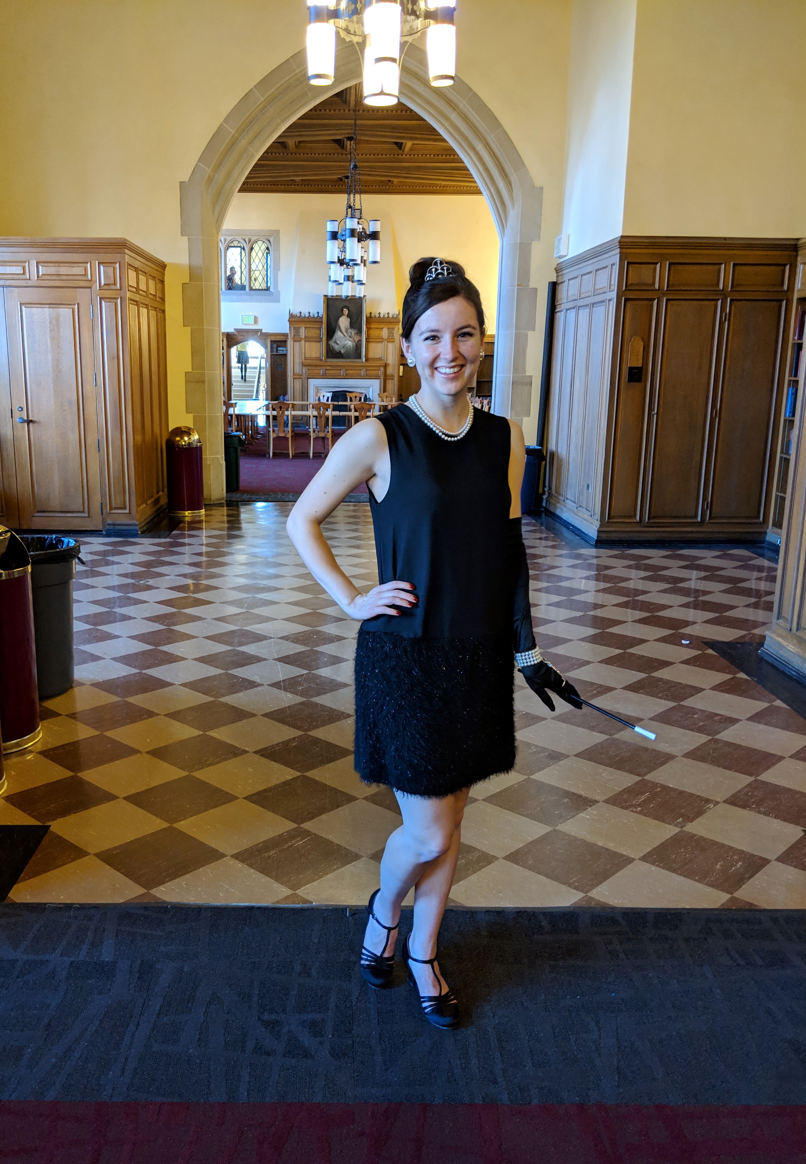 Pretty girl in black dress and t-strap heels