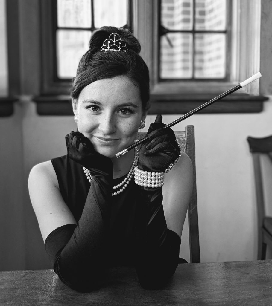 Wearing an Audrey Hepburn costume to recreate an iconic photo