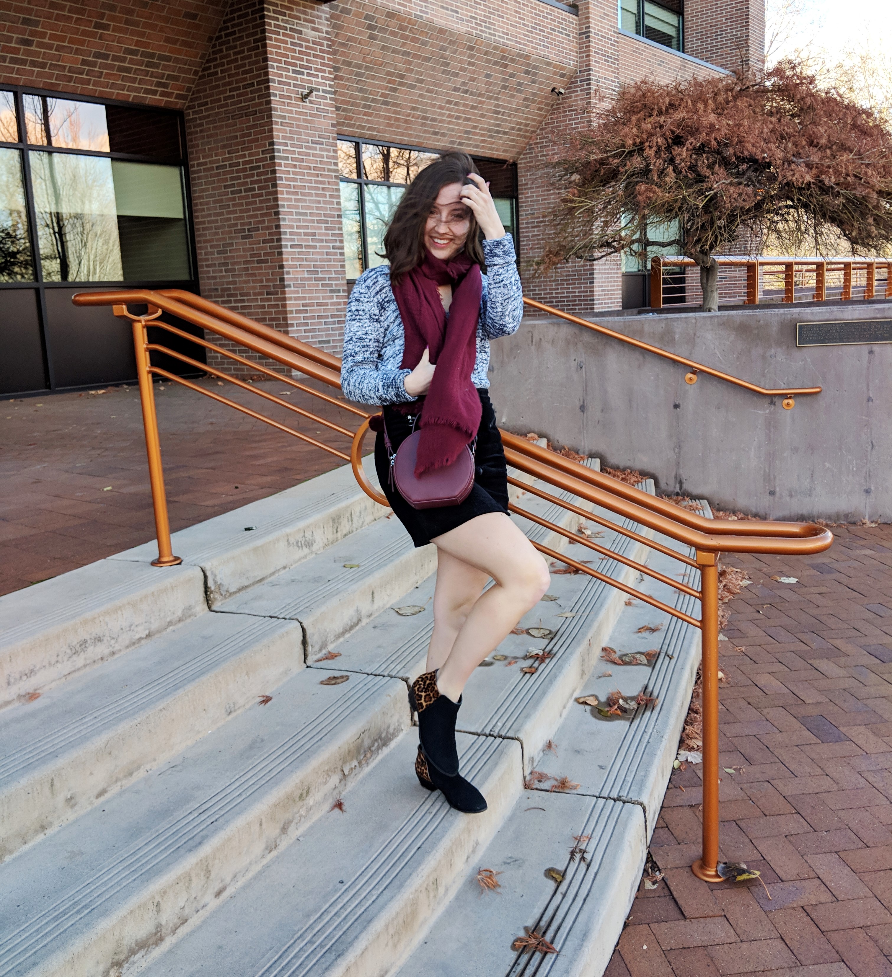 cozy winter outfit with burgundy accessories