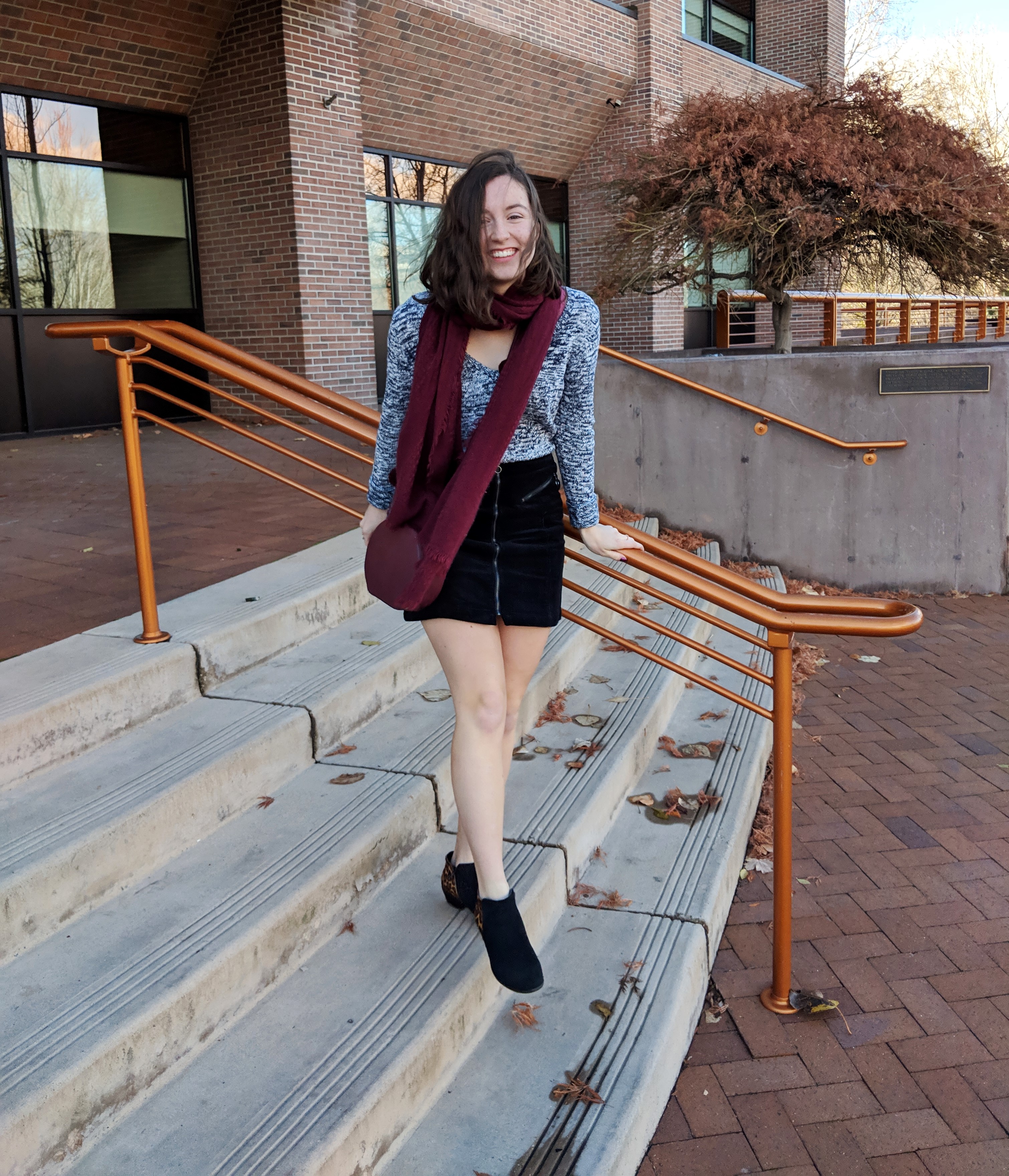 maroon accessories and heathered sweater