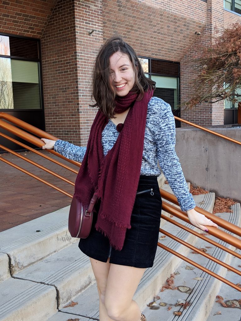 black mini skirt hair flip maroon accessories