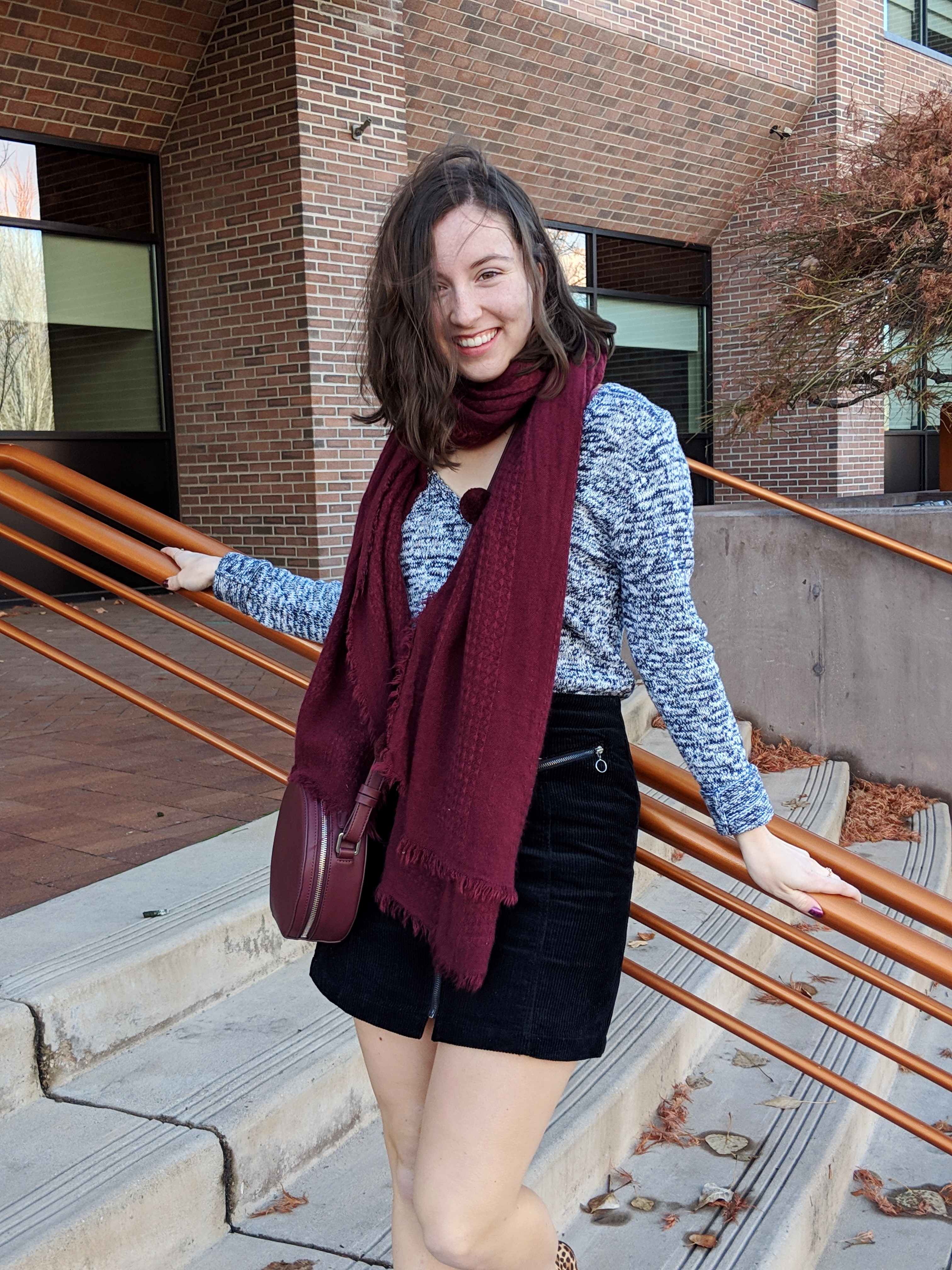 black mini skirt hair flip maroon accessories