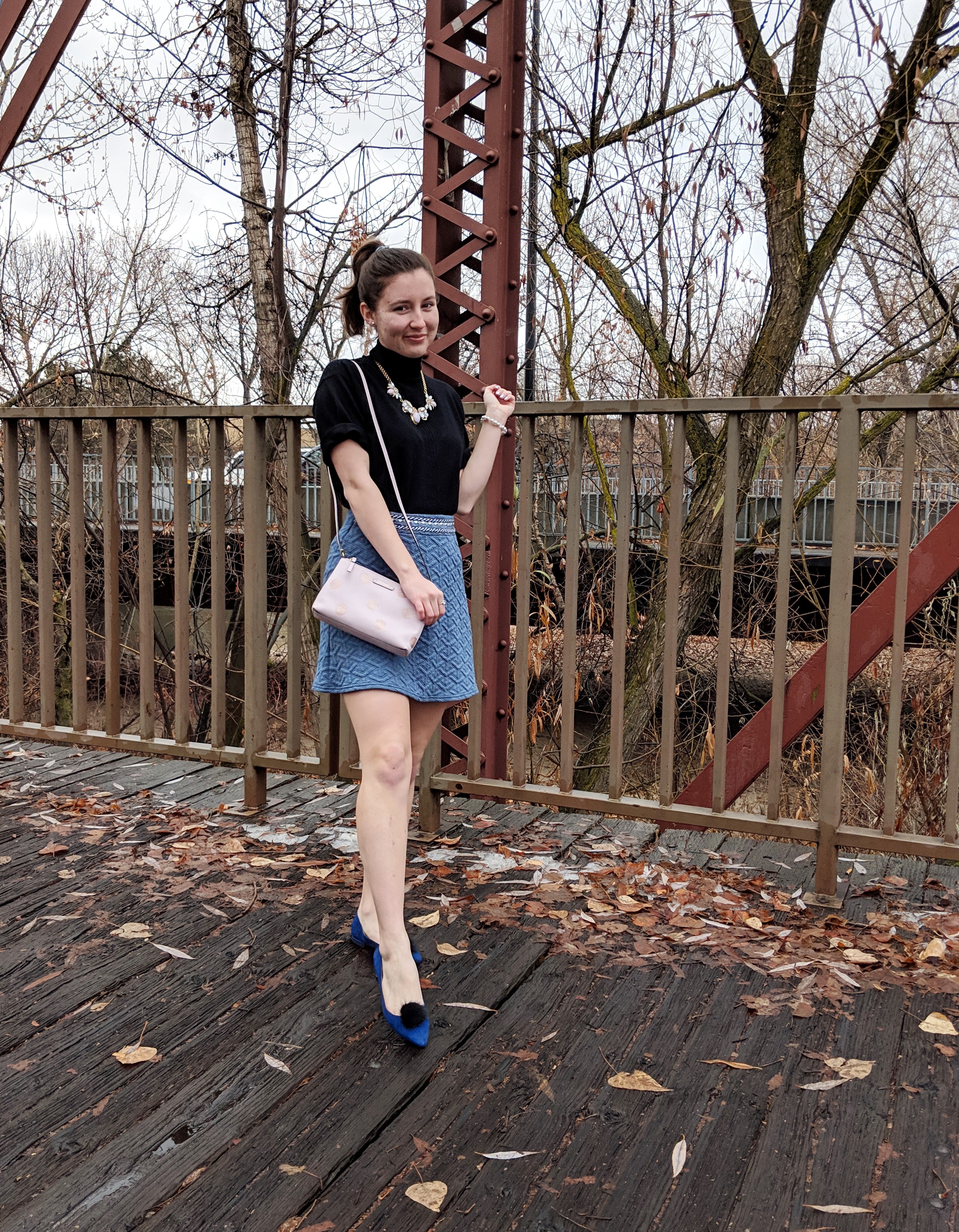 blue flats with black pom pom shoe clips