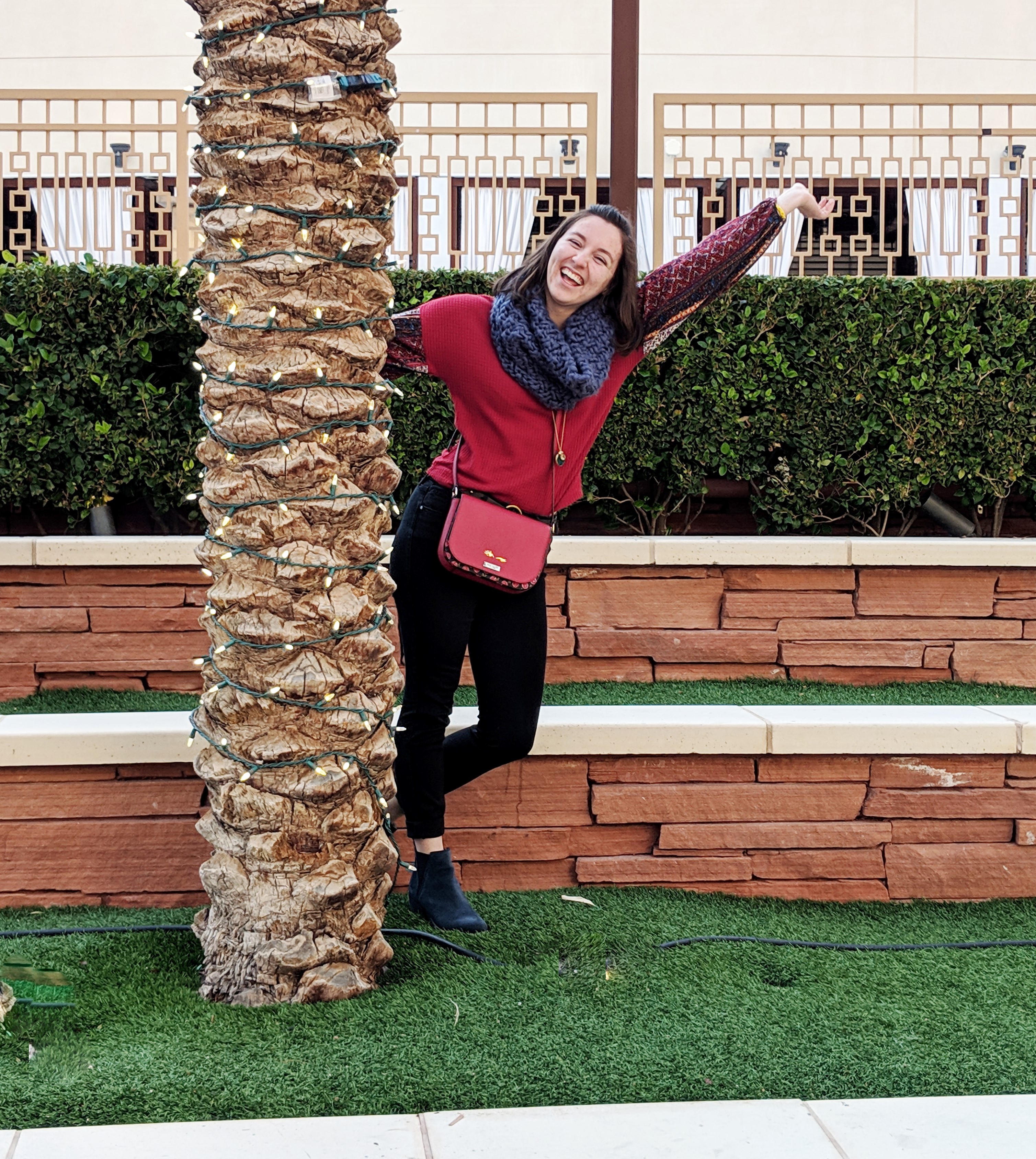 patterned red top and black skinny jeans