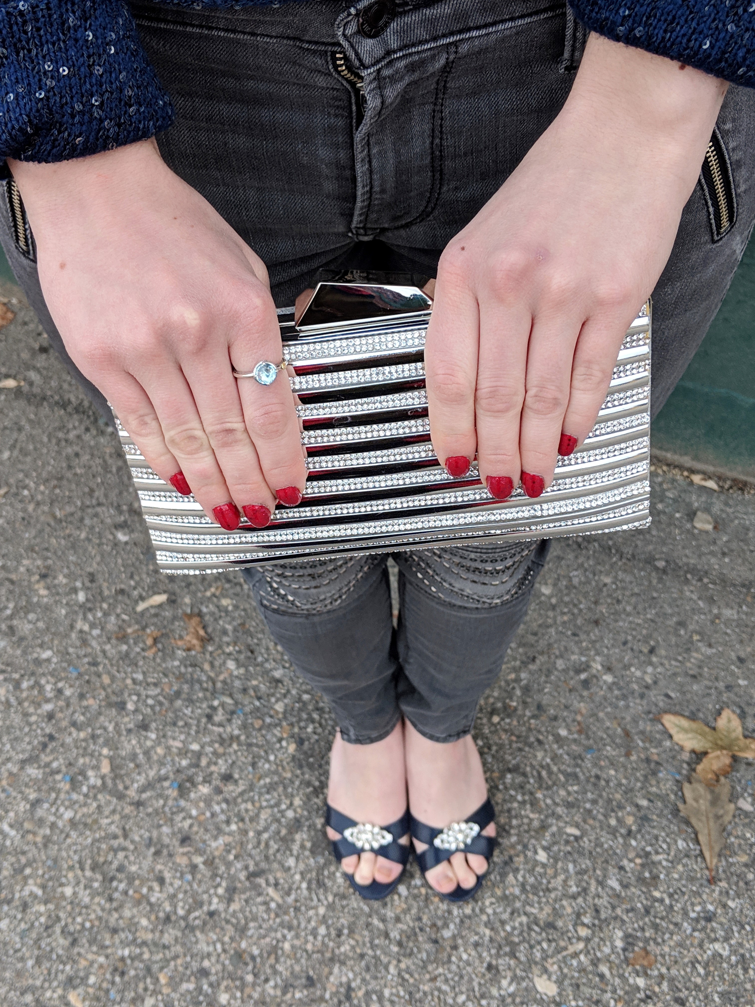 silver purse red nails navy heels