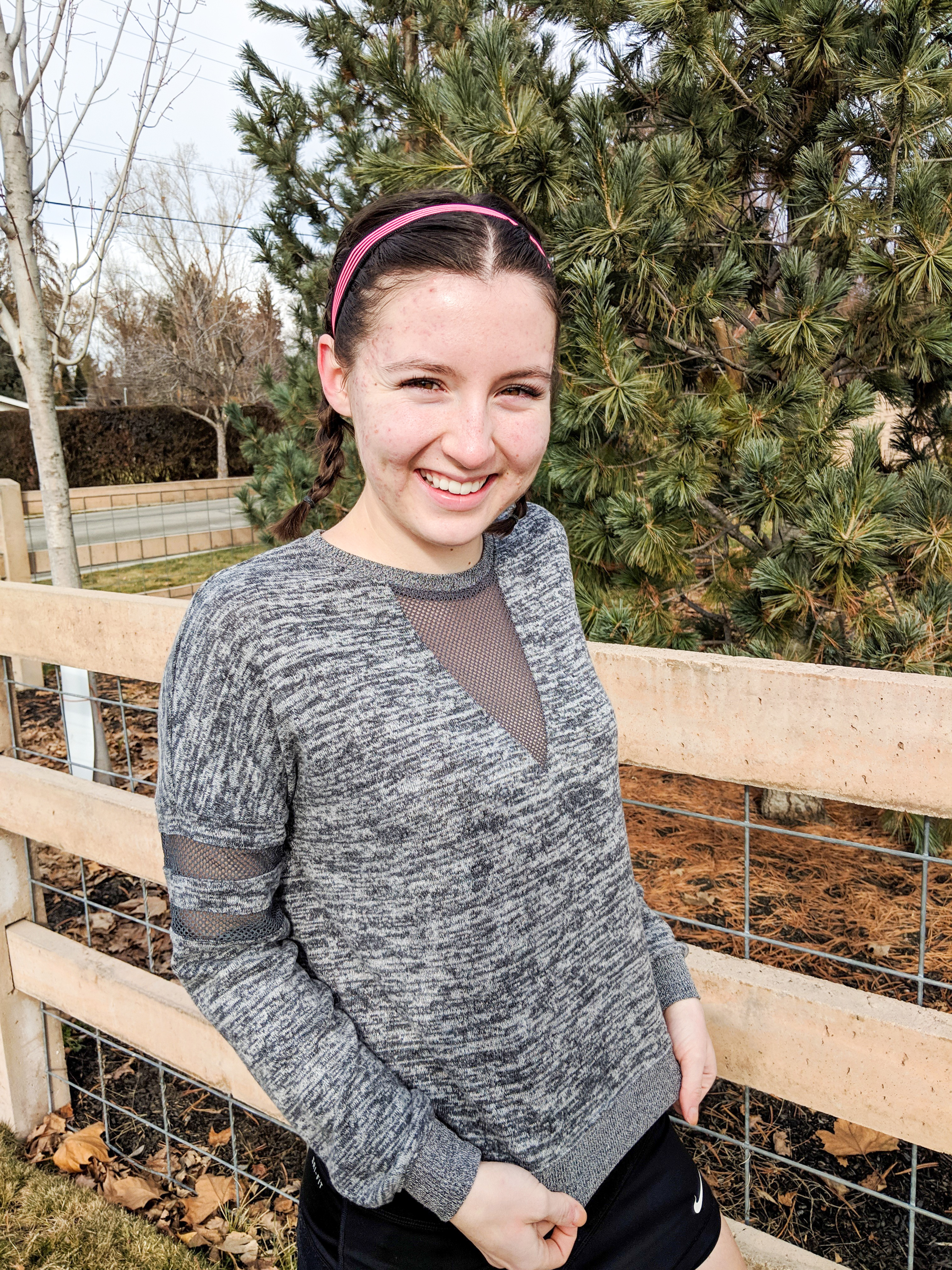 grey sweatshirt with mesh detail, black tennis skirt