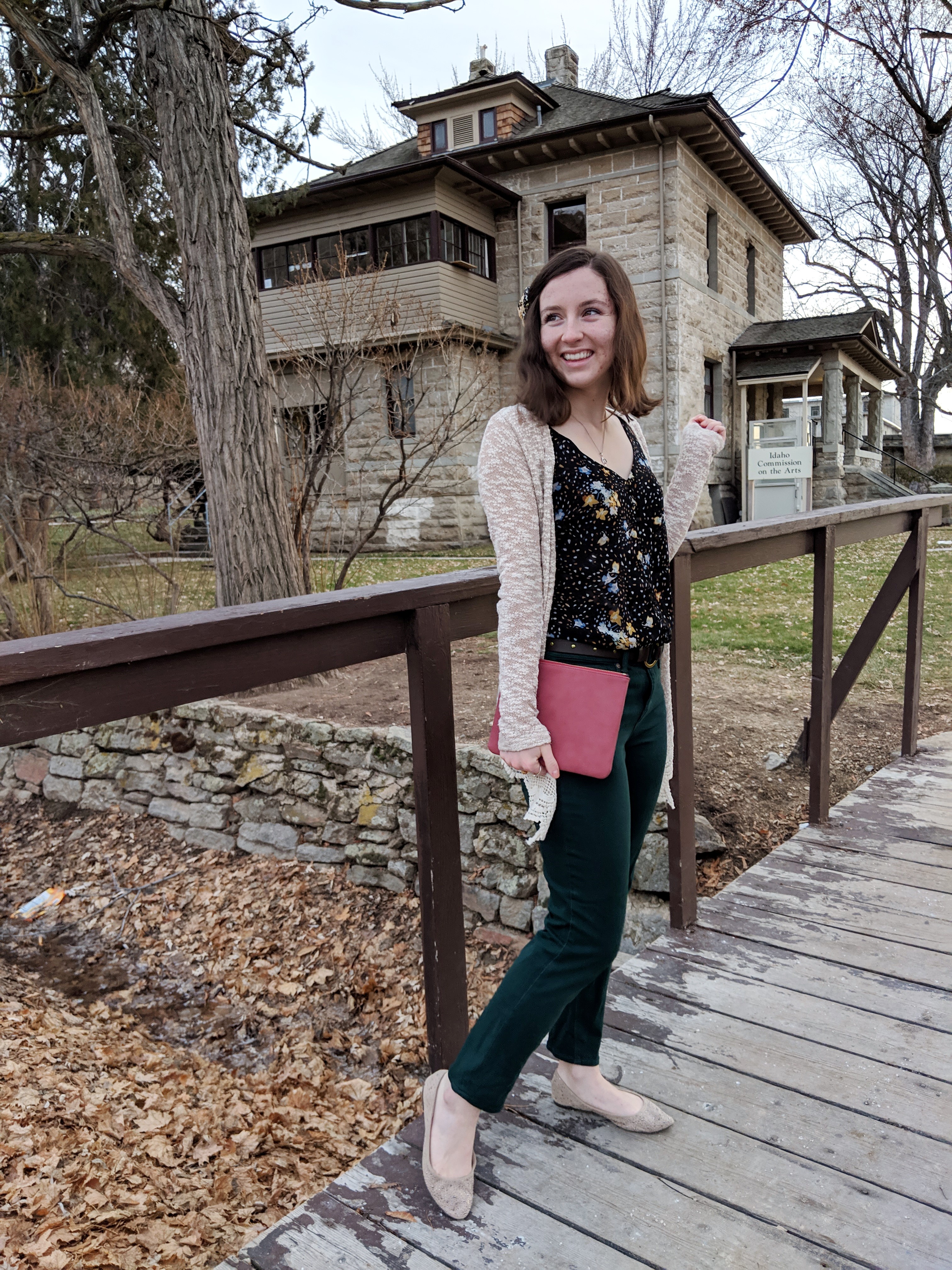 black floral tank and green pants