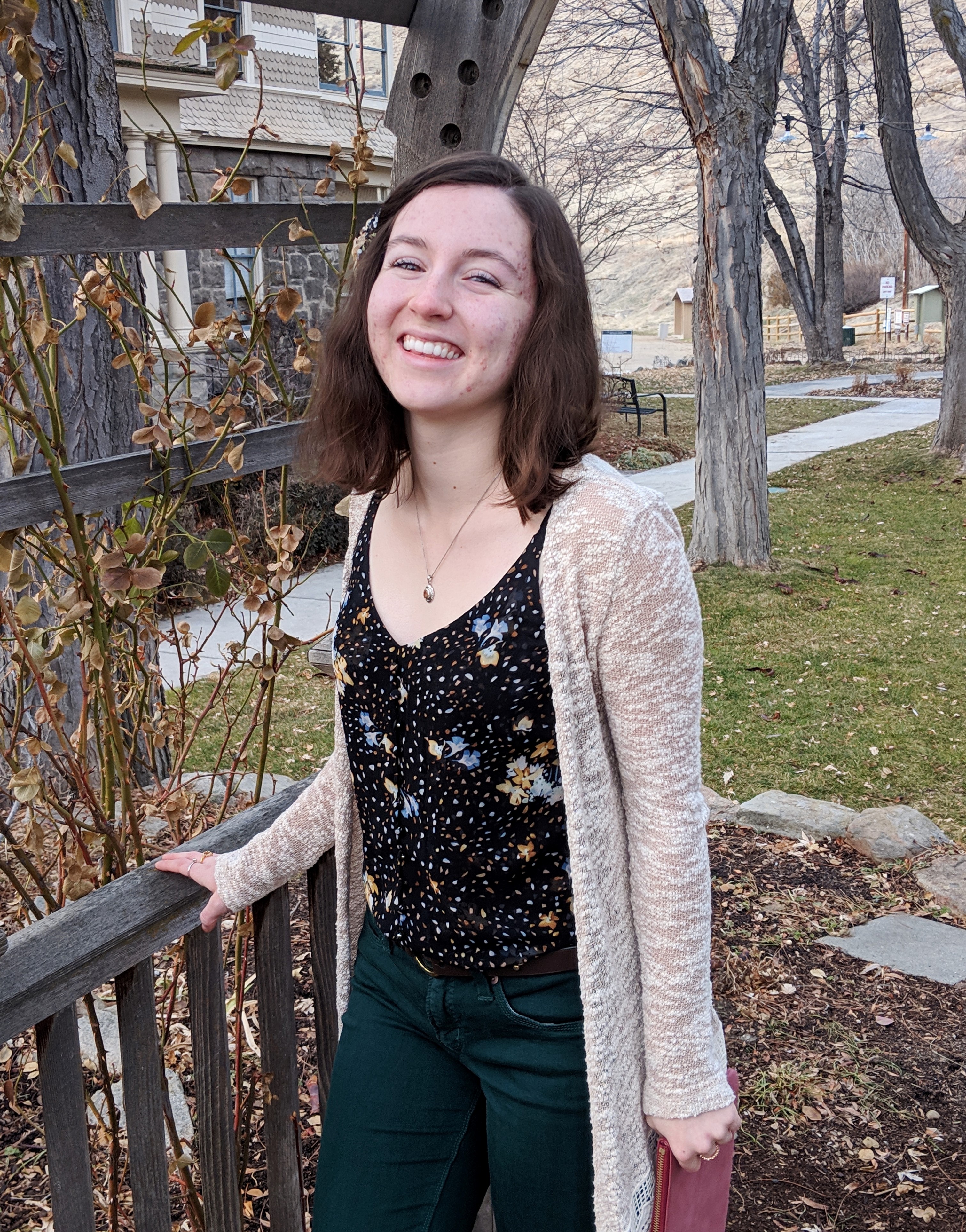 black floral tank top with beige cardigan