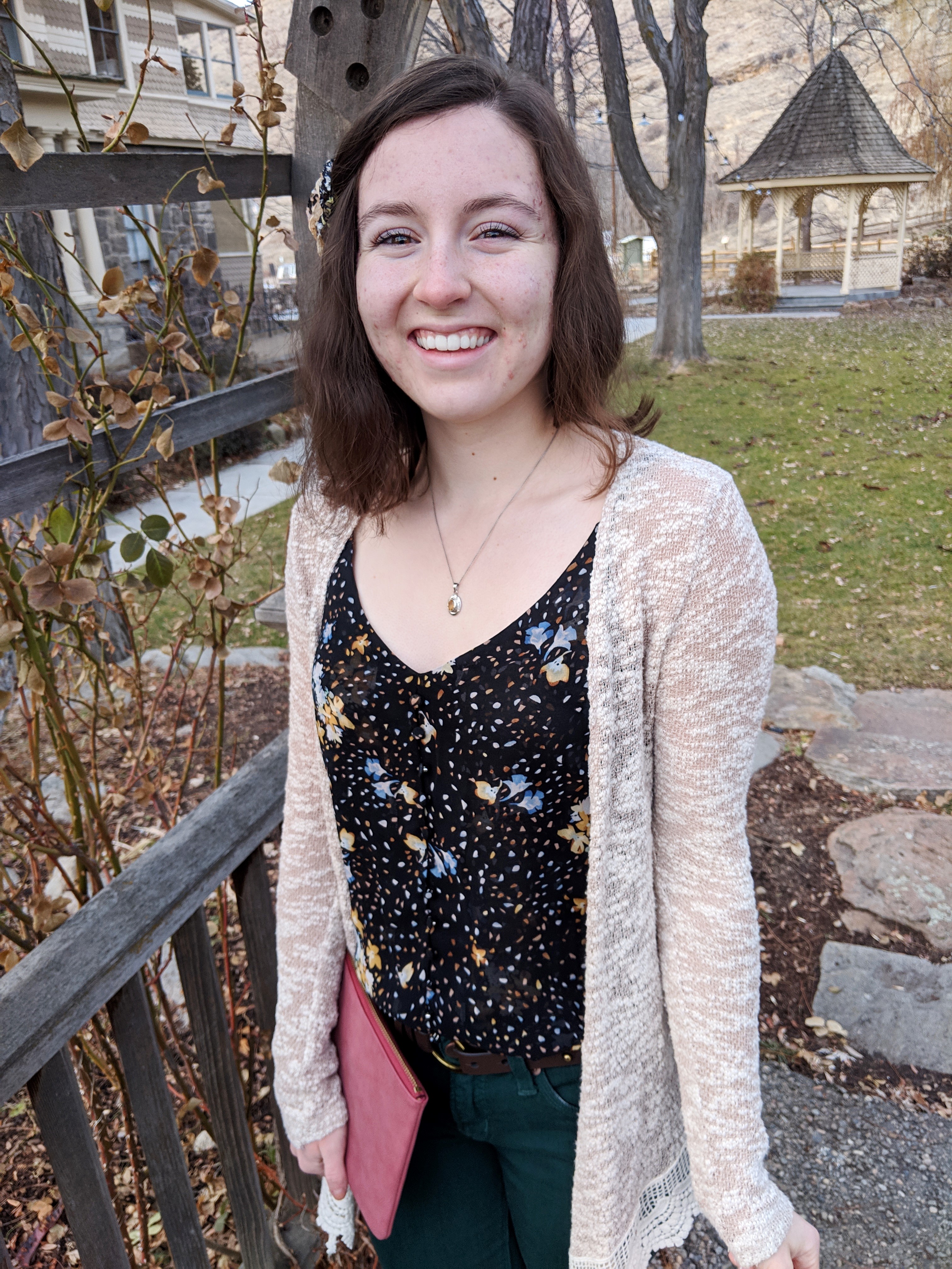 black floral camisole and beige cardigan