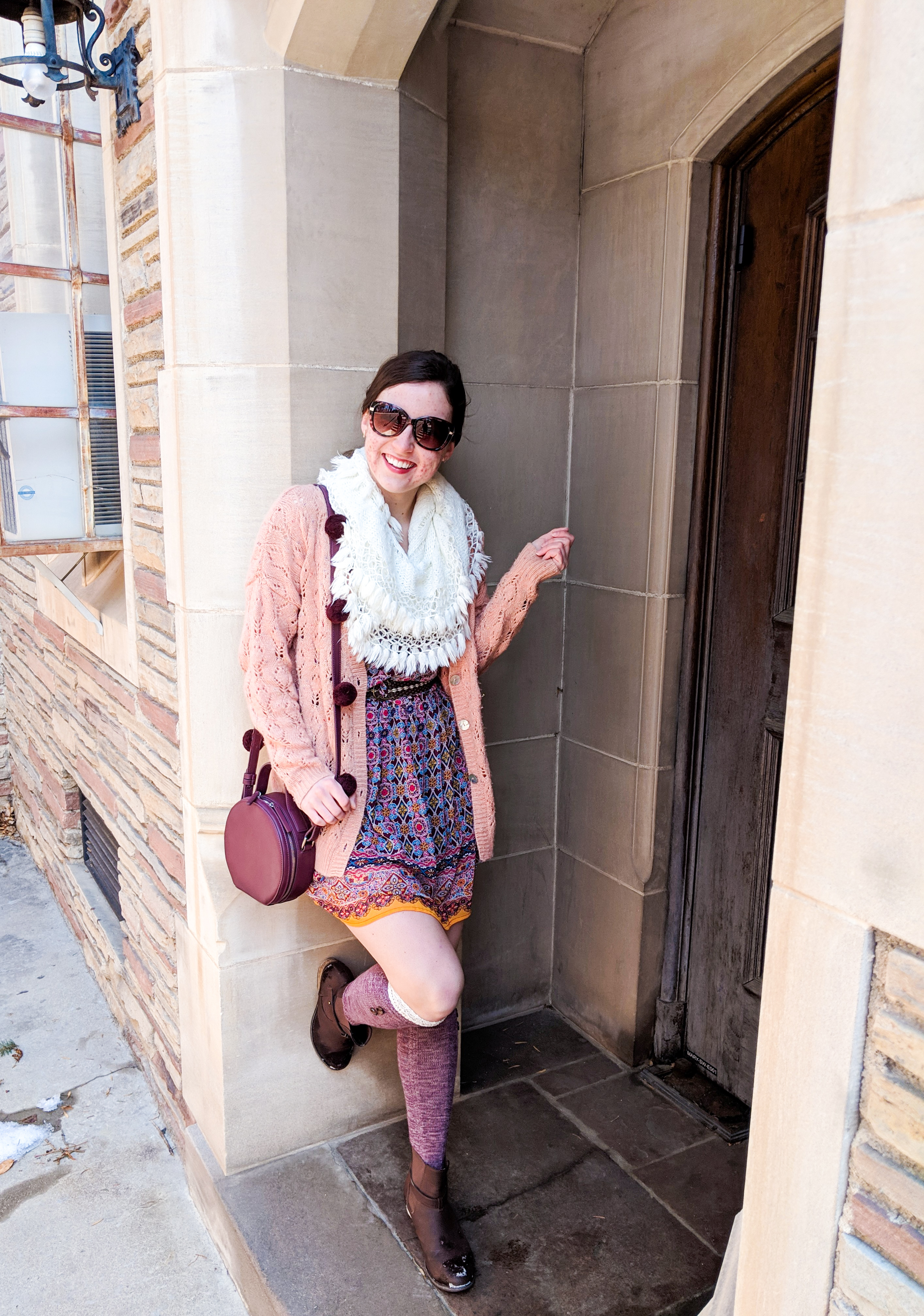 burgundy circle purse, patterned dress, coral sweater