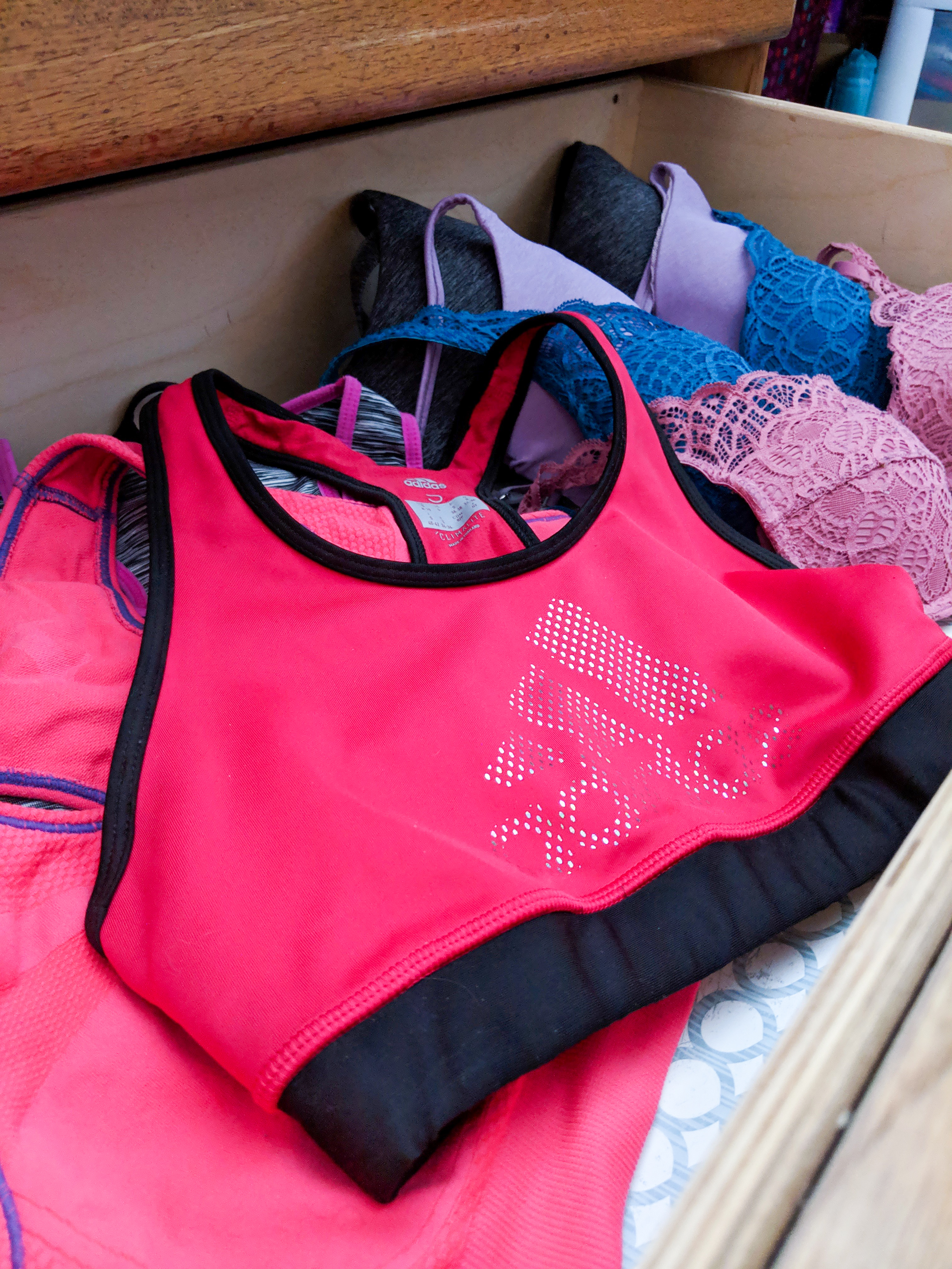 intimates drawer, red Adidas sports bra