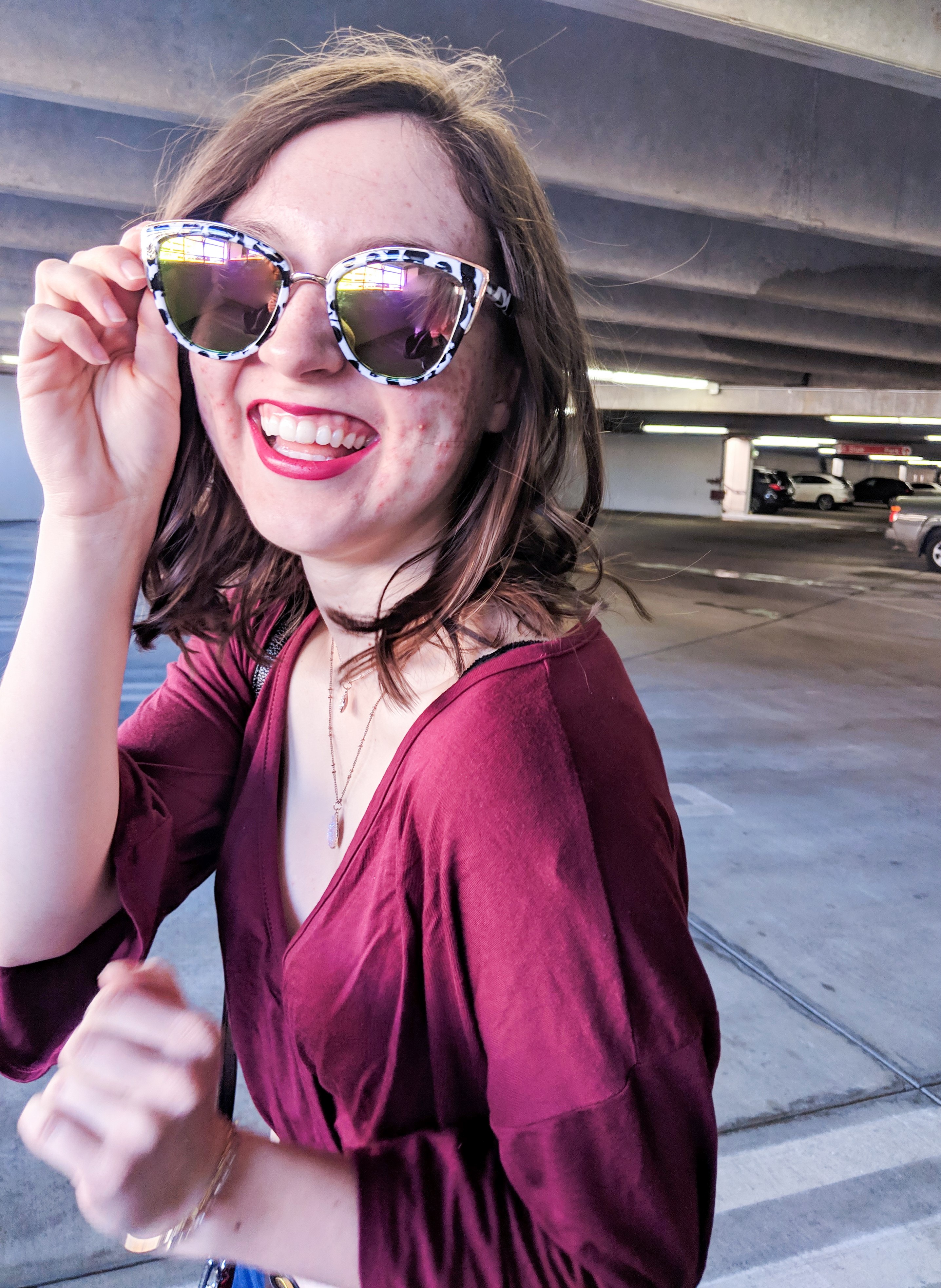 black and white sunglasses and Revlon super lustrous lipstick