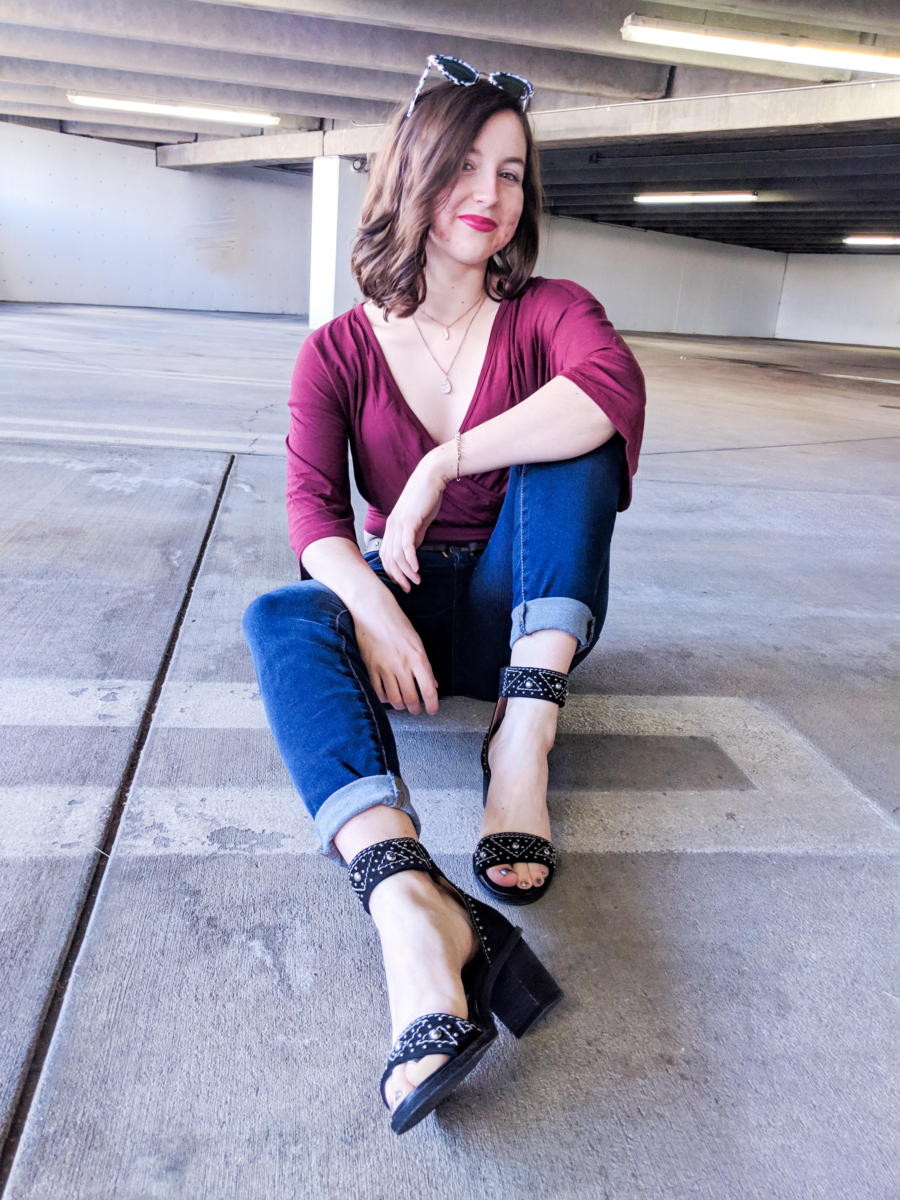 edgy maroon top and skinny jeans