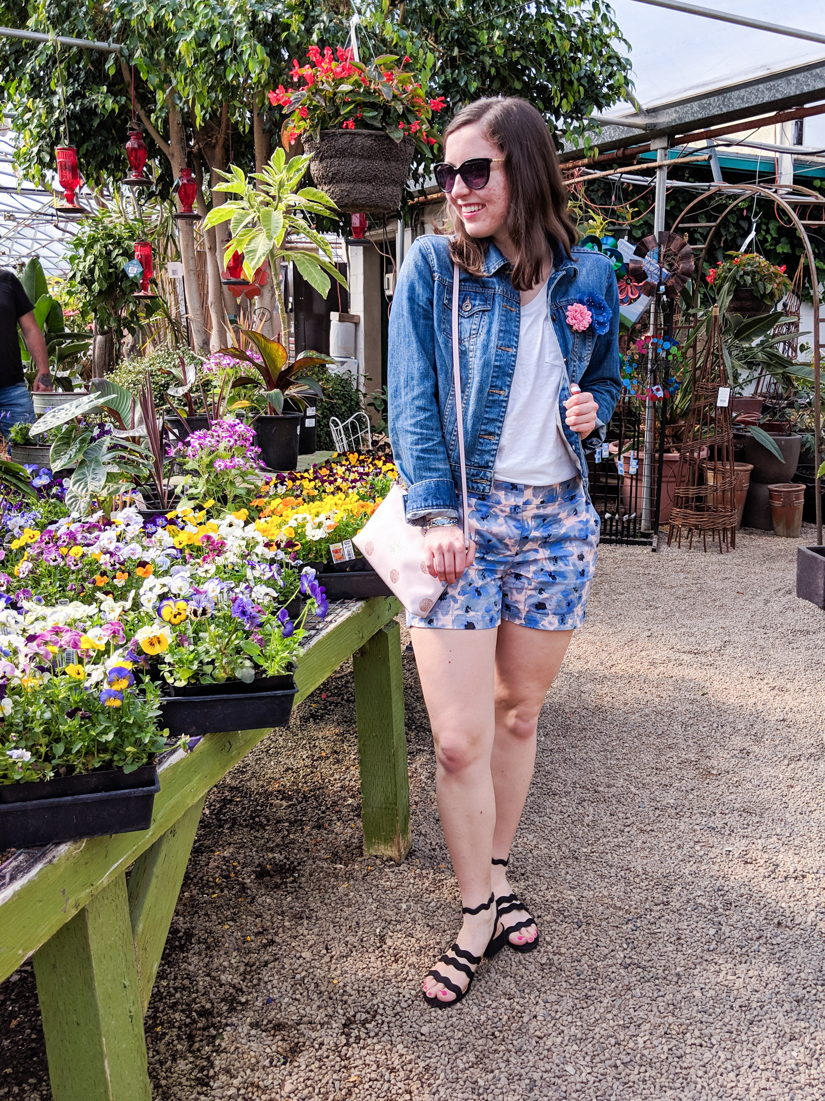 accessorizing a spring outfit with brooches, hair pins, and layered jewelry
