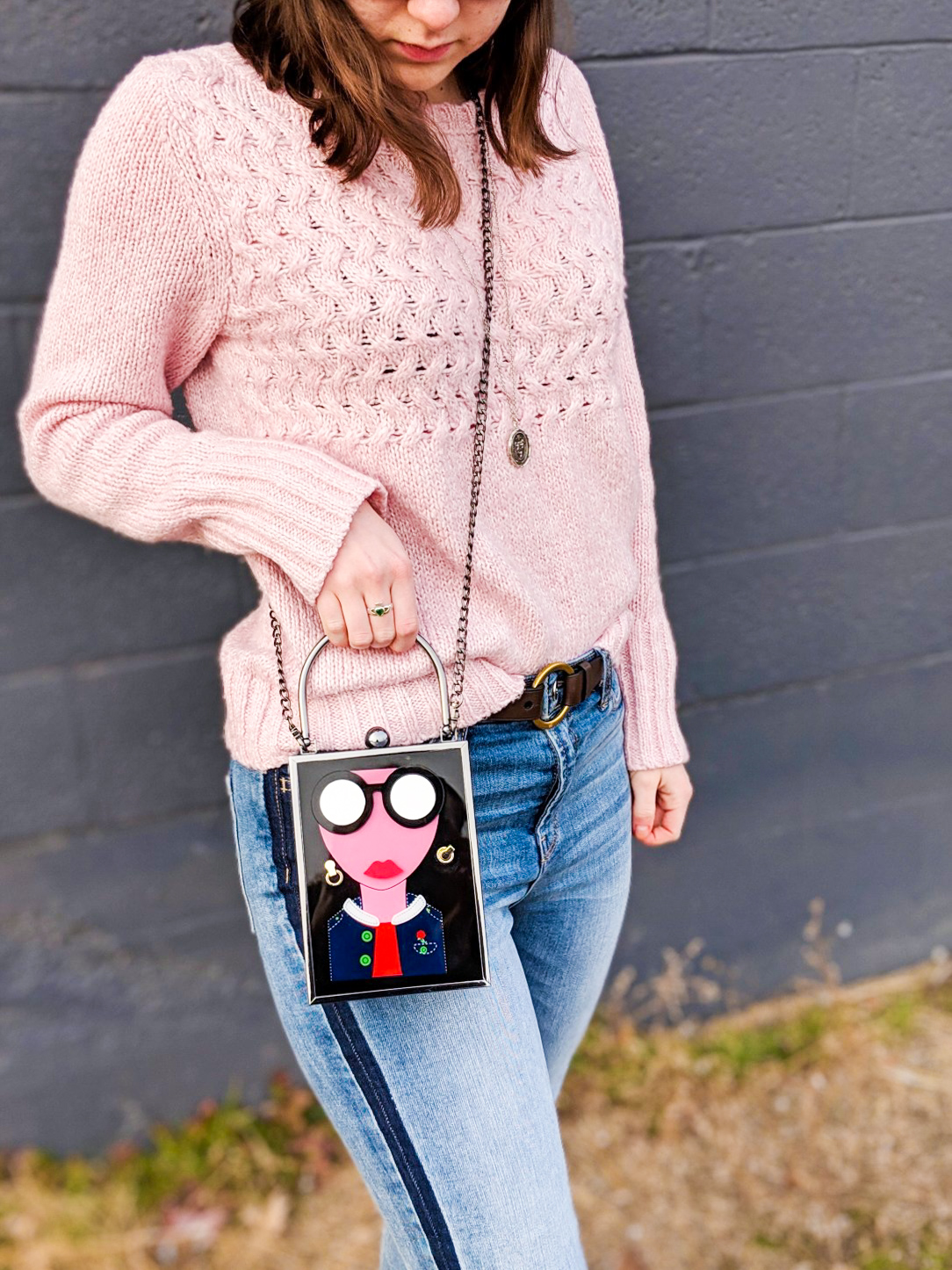 pink sweater, tuxedo stripe jeans, brown belt, art deco purse, street style