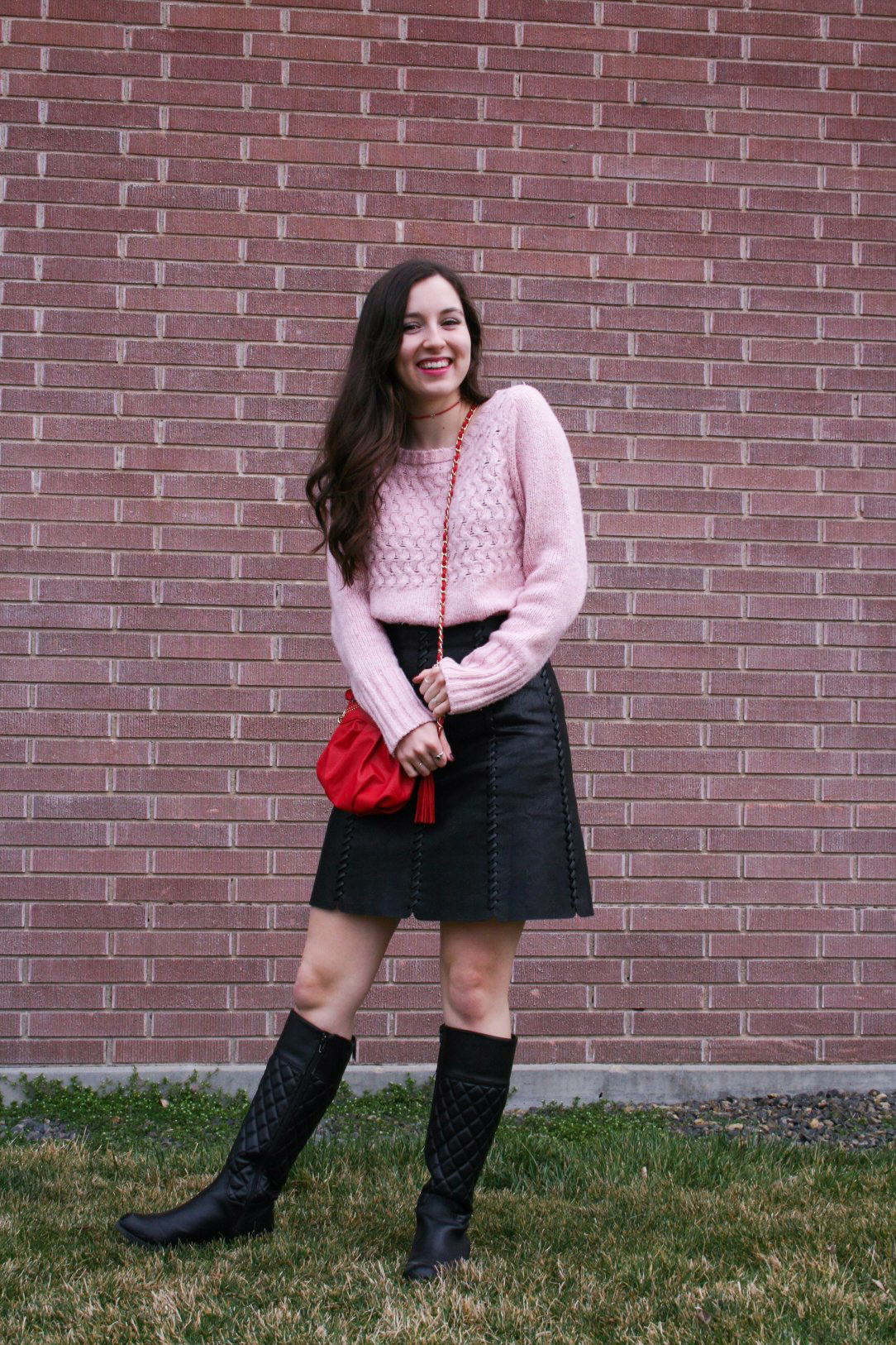 how to style pink, pink sweater, red purse, black pleather skirt, black boots