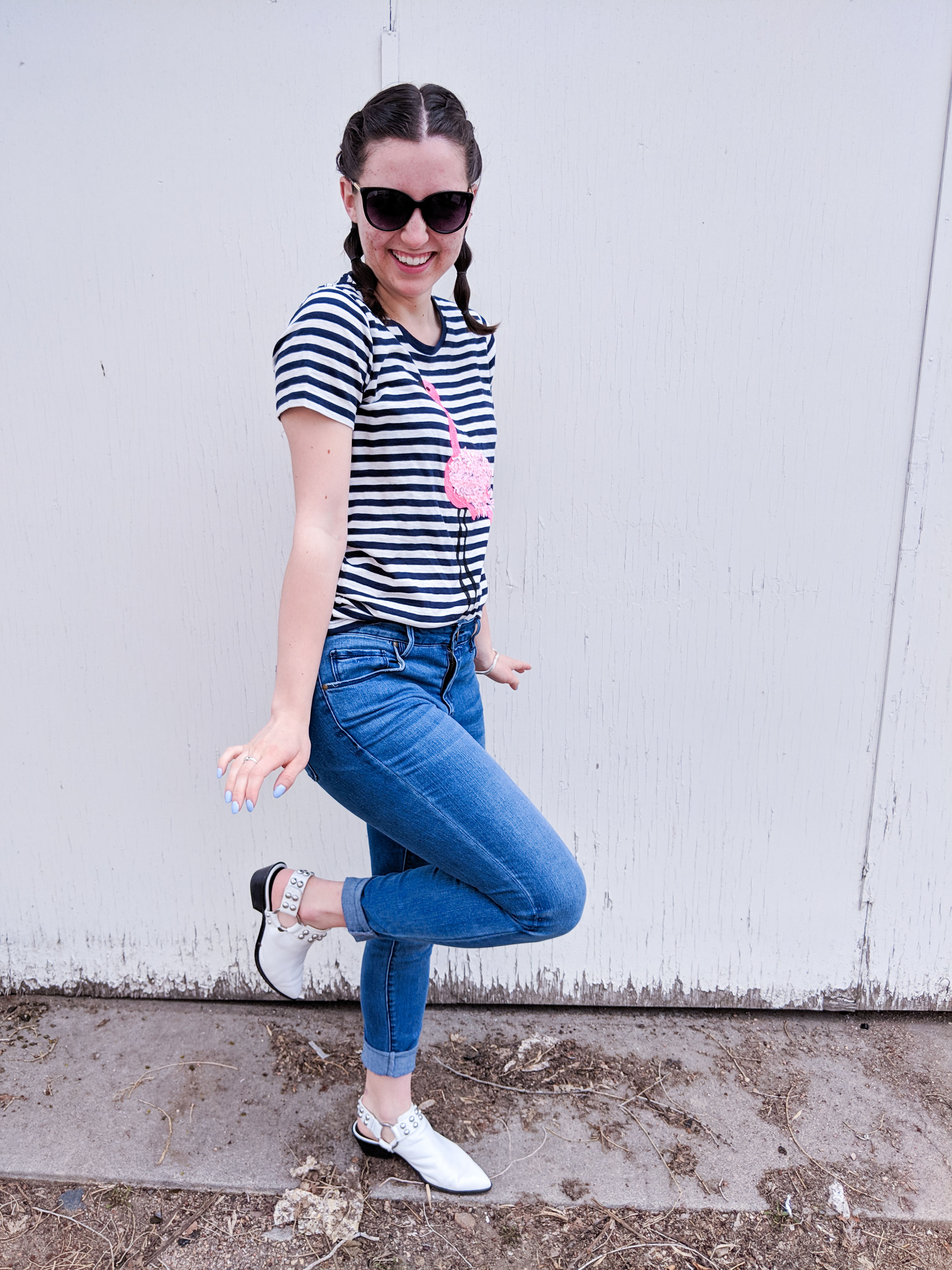 flamingo pose, striped tee, Francesca's jeans