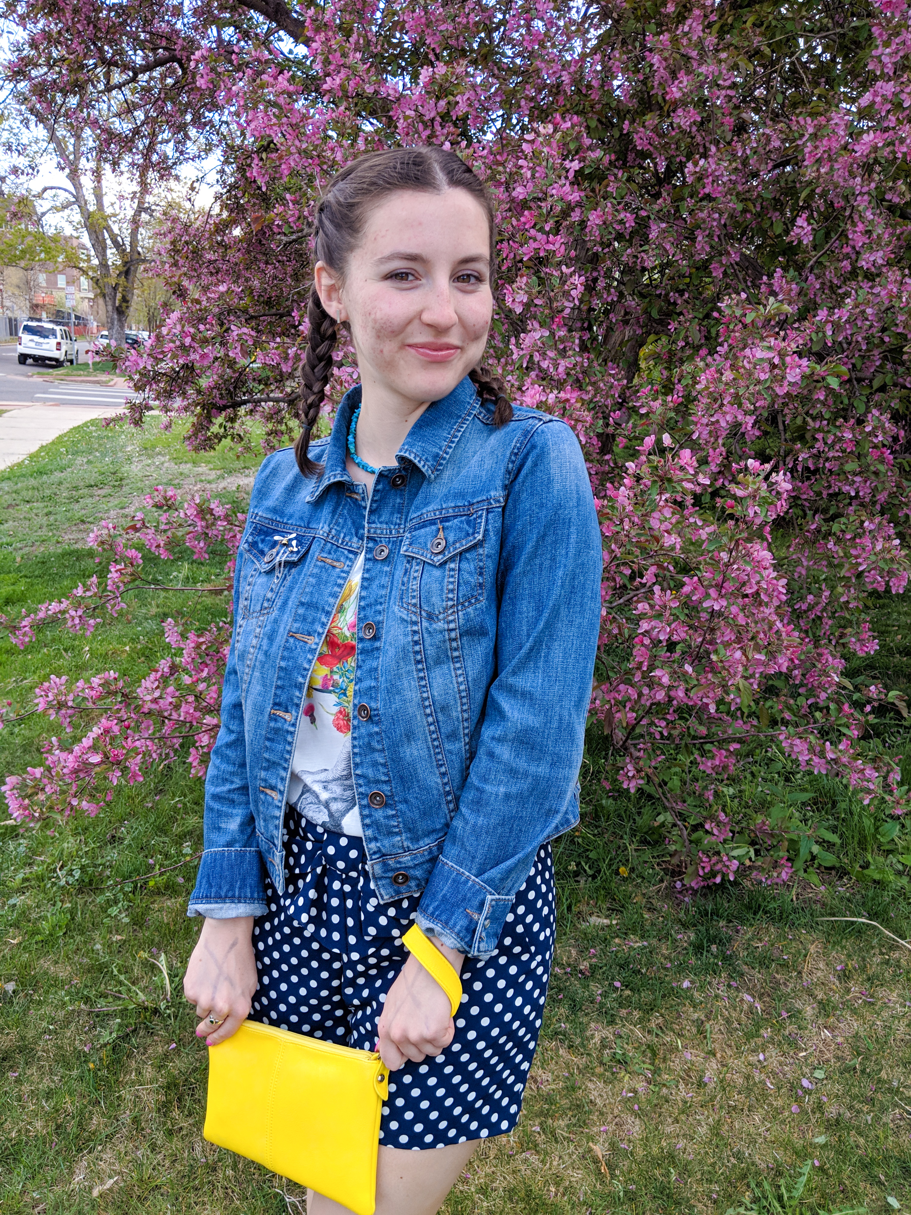 polka dot shorts, graphic tee, yellow purse, jean jacket