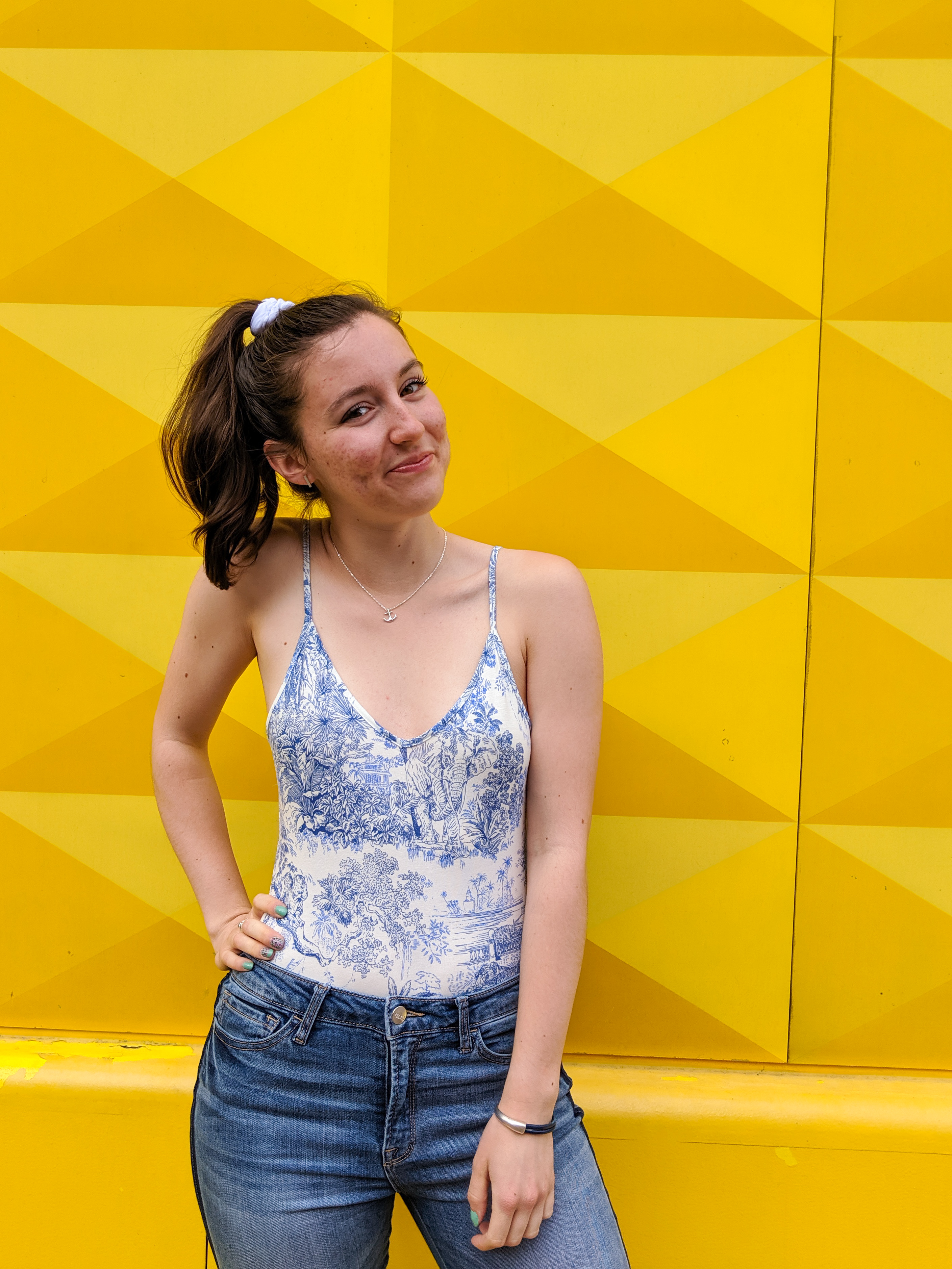 blue and white bodysuit, skinny jeans