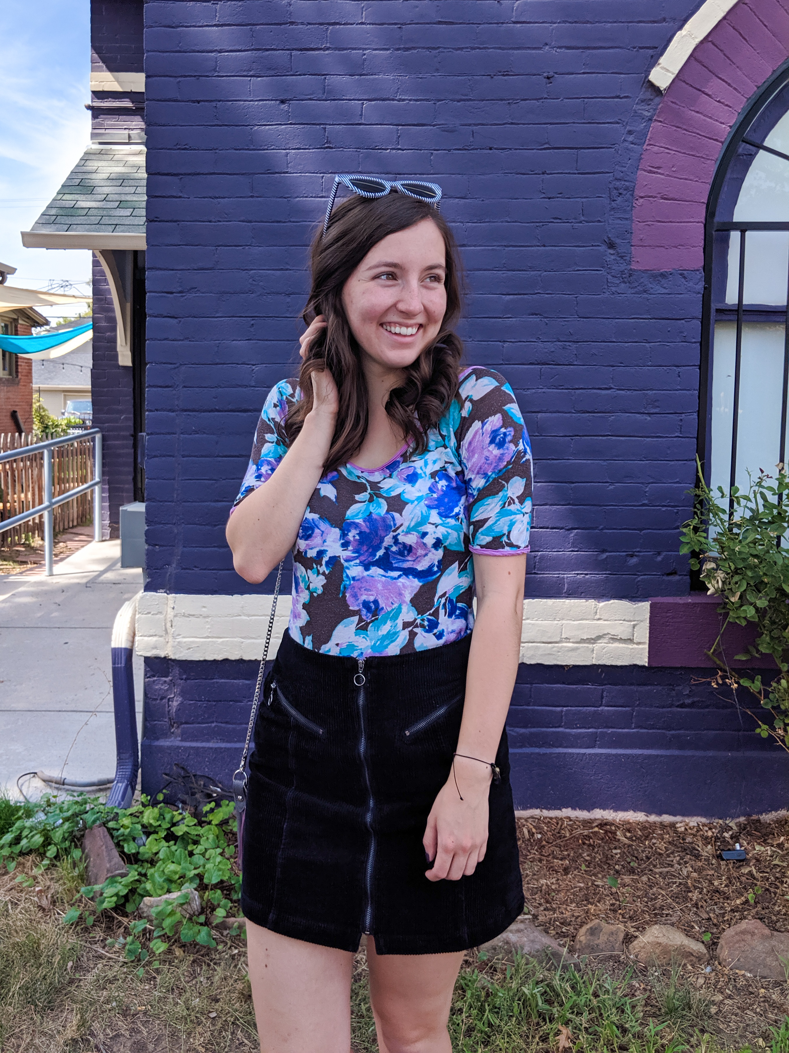 vision in purple, purple blouse, black skirt