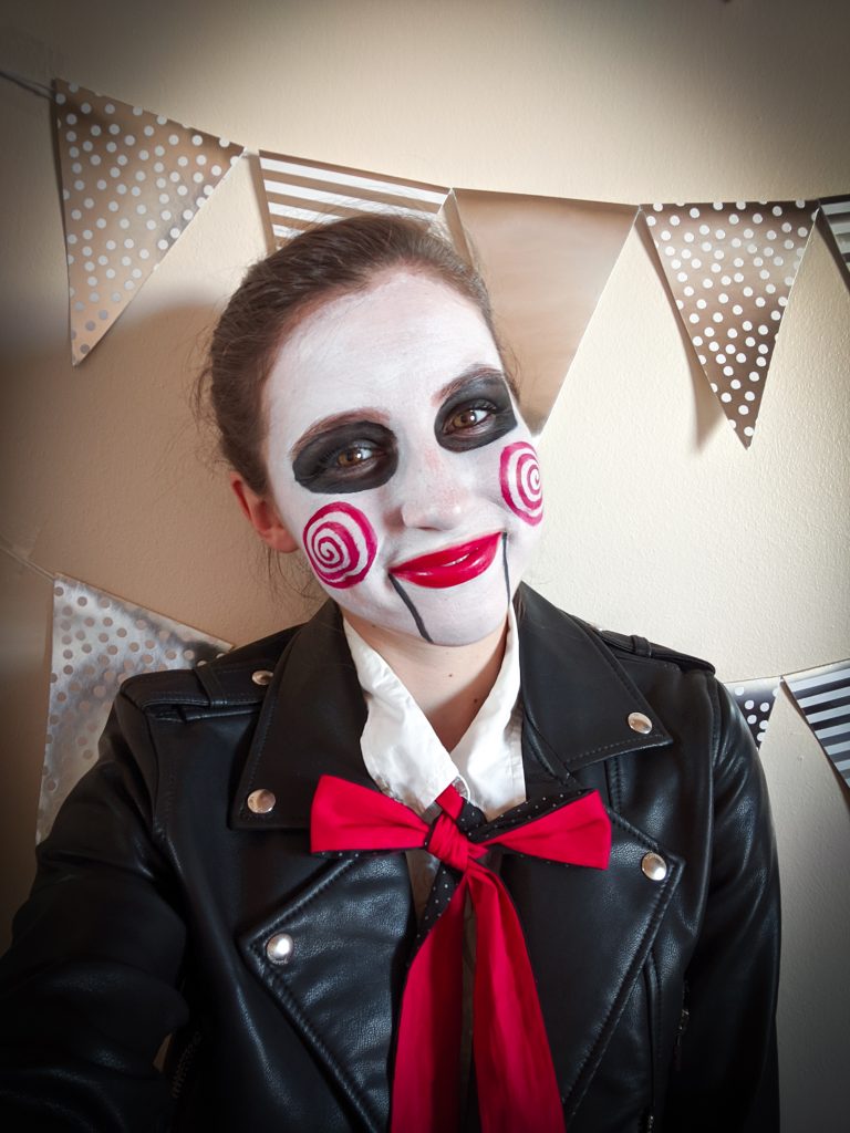 puppet, black pleather jacket, red lipstick