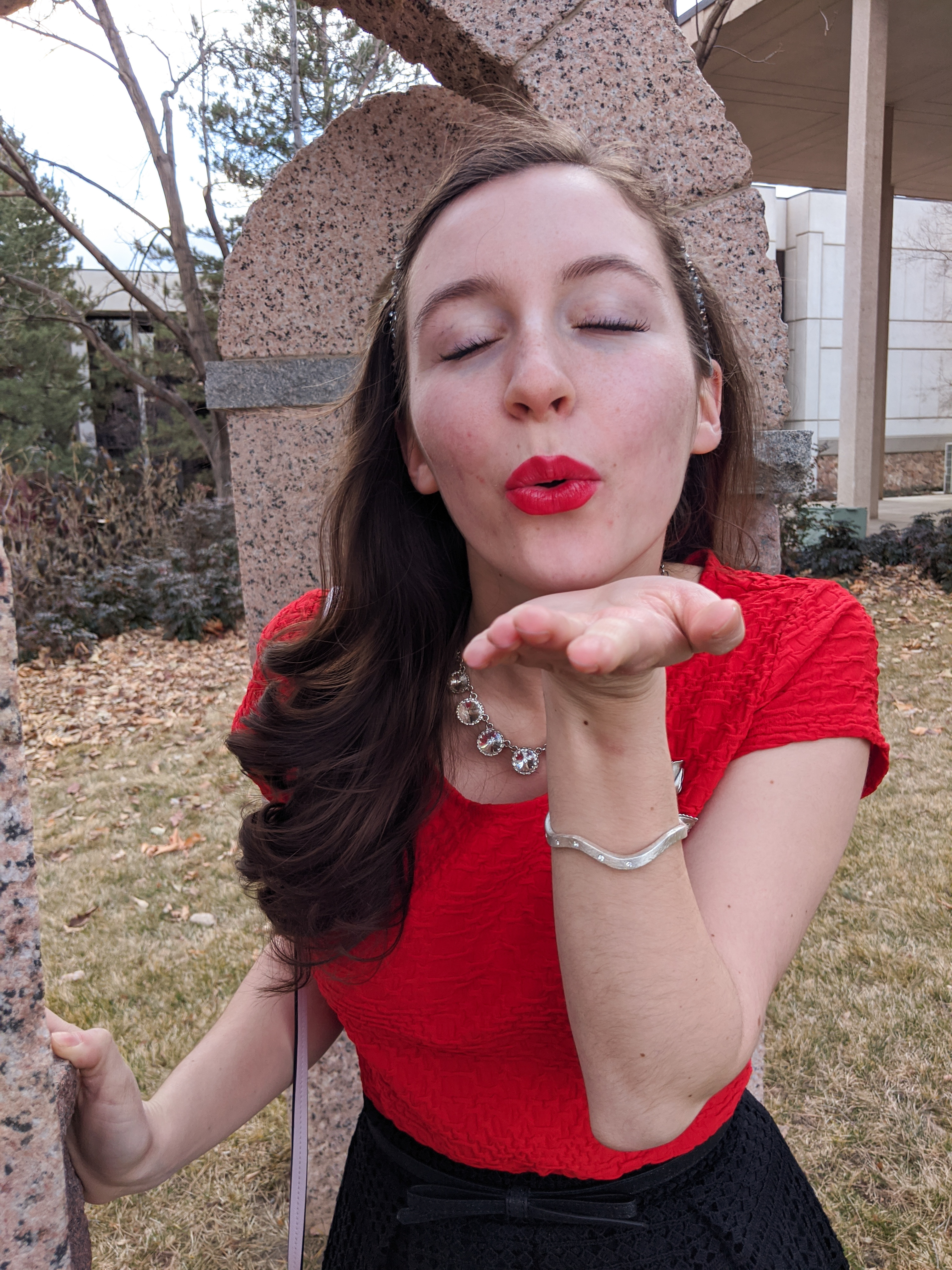 blowing a kiss, lip patterns, heart themed clothing