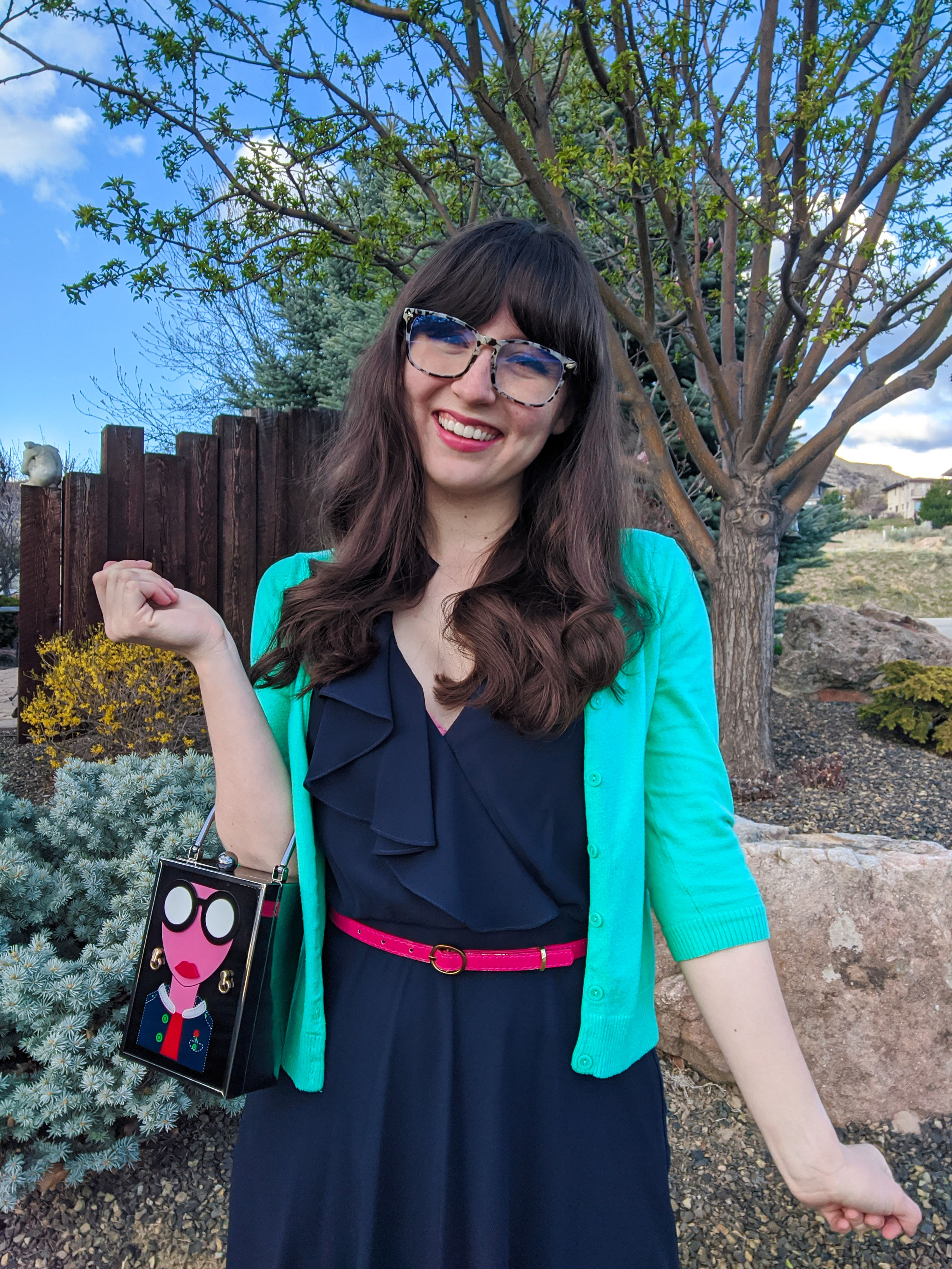 ruffle navy dress, green cardigan, pink belt, New Girl style