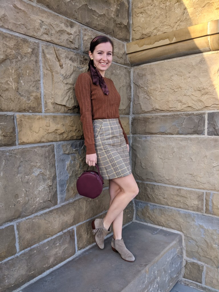 plaid-skirt-brown-sweater-circle-purse
