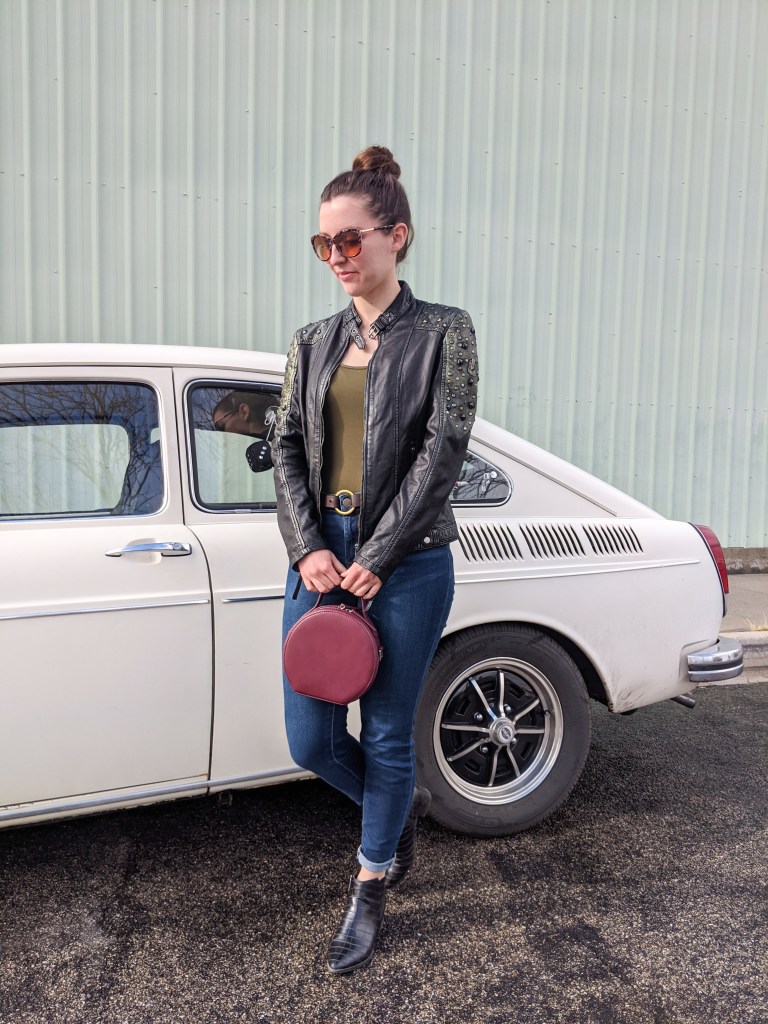 maroon-bodysuit-leather-jacket-skinny-jeans-circle-purse-fastback