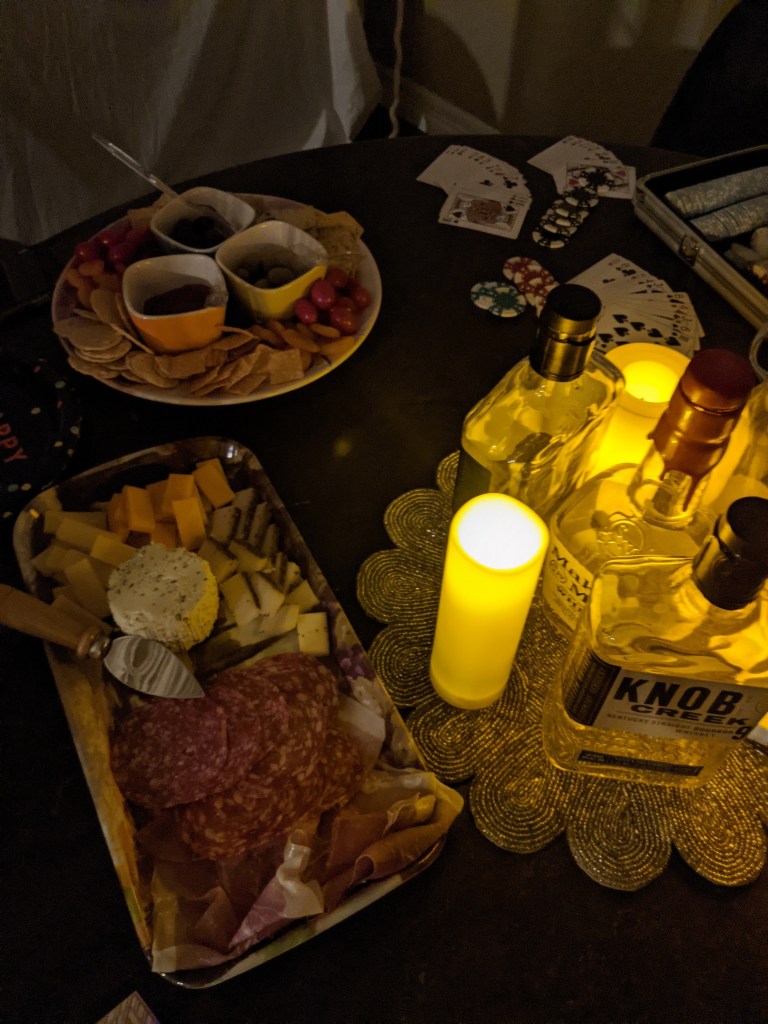 charcuterie-board-meats-cheeses-fake-candles-bacon-jam