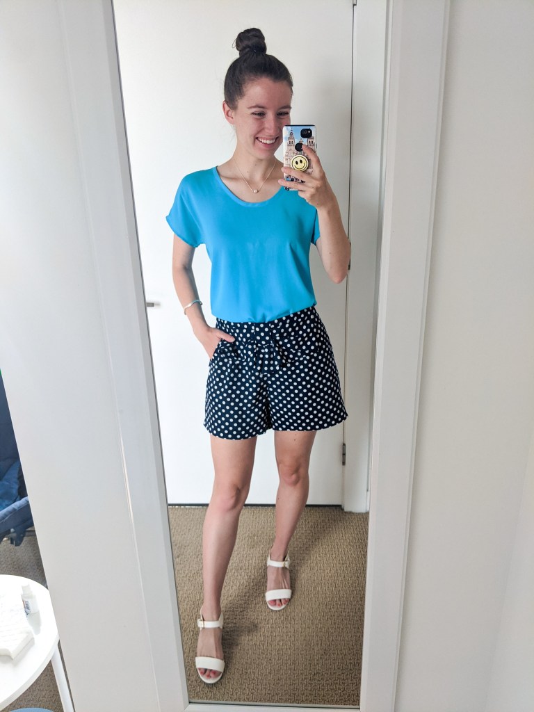 blue-blouse-polka-dot-shows-white-heels