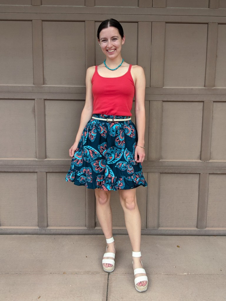 orange-top-navy-patterned-skirt-complementary-colors