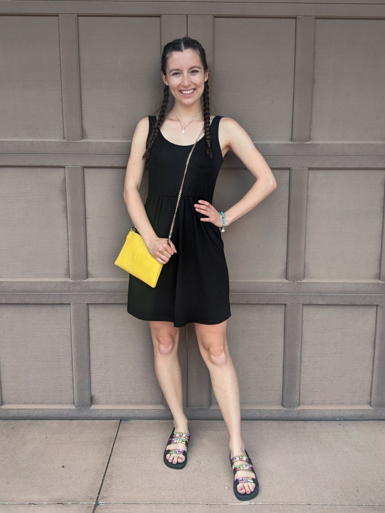 black-tank-dress-yellow-purse-beaded-sandals