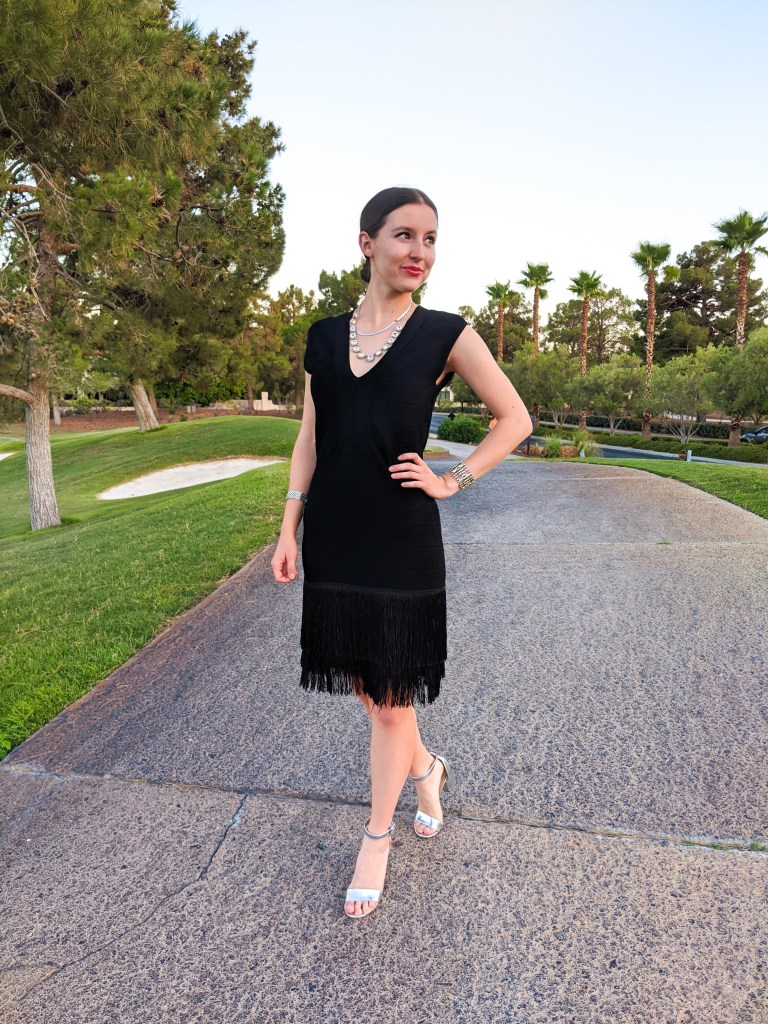black-fringe-formfitting-dress-silver-block-heels-low-bun