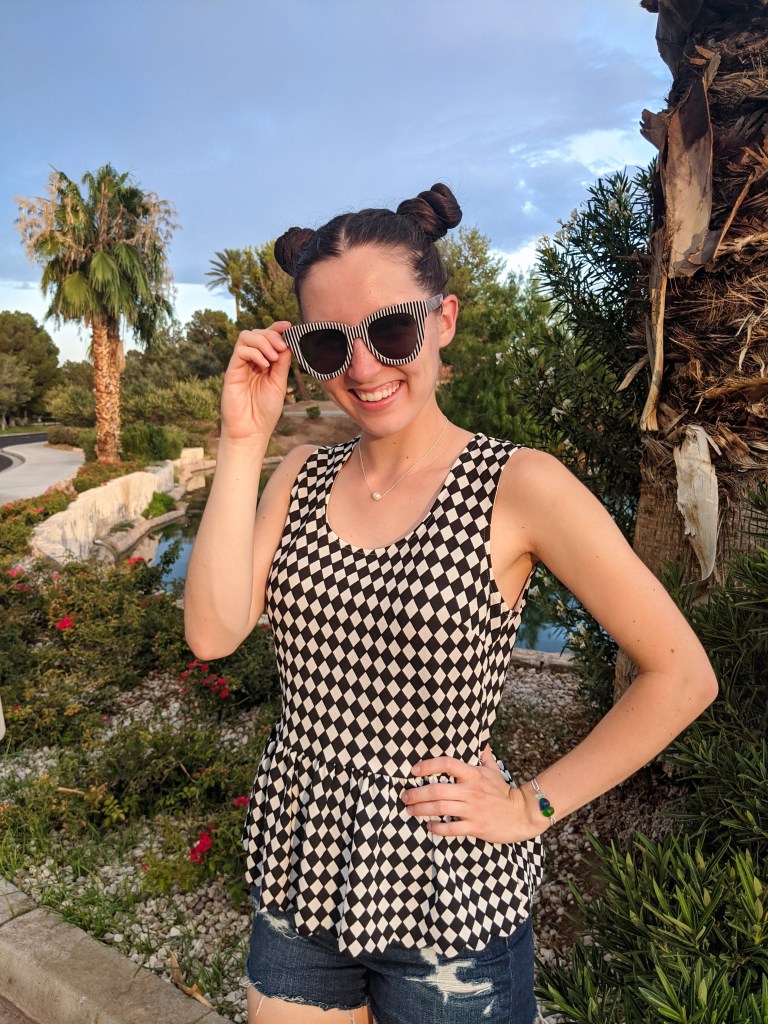 space-buns-checkered-peplum-denim-shorts-striped-sunglasses