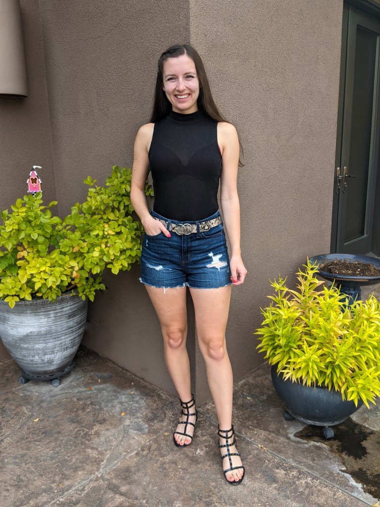 black-mock-neck-top-denim-shorts-snakeskin-belt-black-sandals