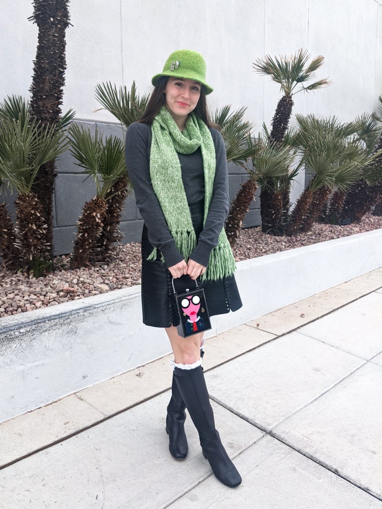 green-felt-hat-green-scarf-box-purse-black-leather-skirt-black-boots