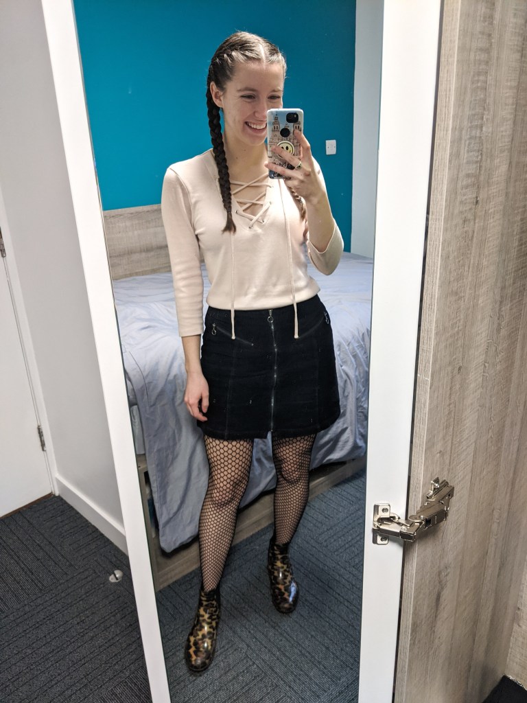 black-corduroy-skirt-blush-laceup-tee-fishnet-tights