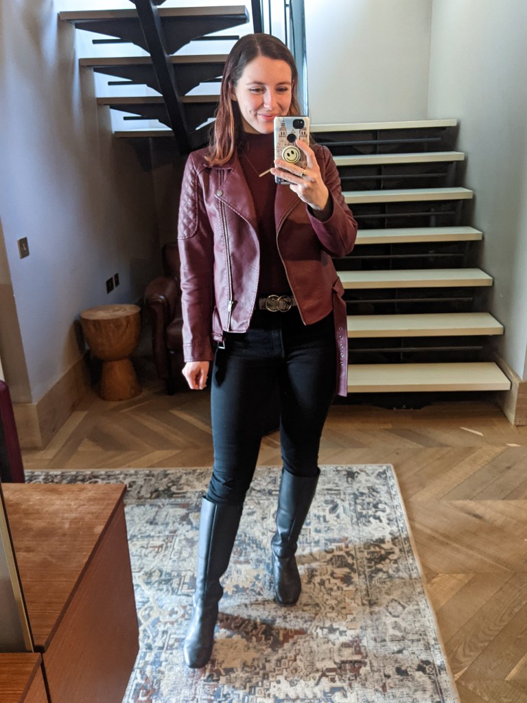 maroon-moto-jacket-mock-neck-top-black-jeans-knee-boots