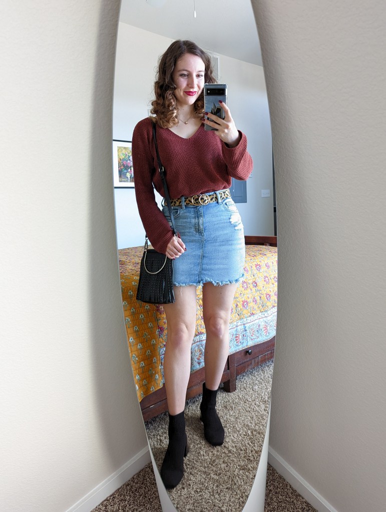 rust-colored-sweater-denim-skirt-leopard-belt-black-vivaia-booties