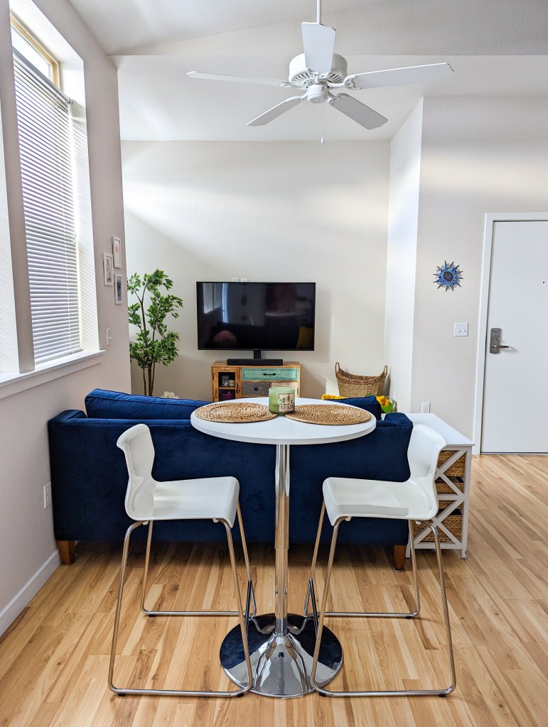 white-bar-table-bar-stools-ikea-blue-couch-studio-apartment