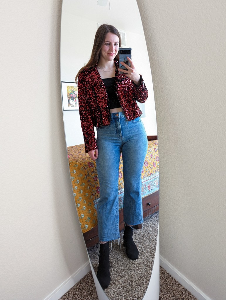 red-sequin-moto-jacket-black-cropped-top-flared-jeans-vivaia-booties