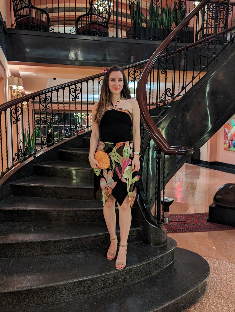 tropical-two-piece-set-orange-beaded-purse-nude-shoes-crimped-hair