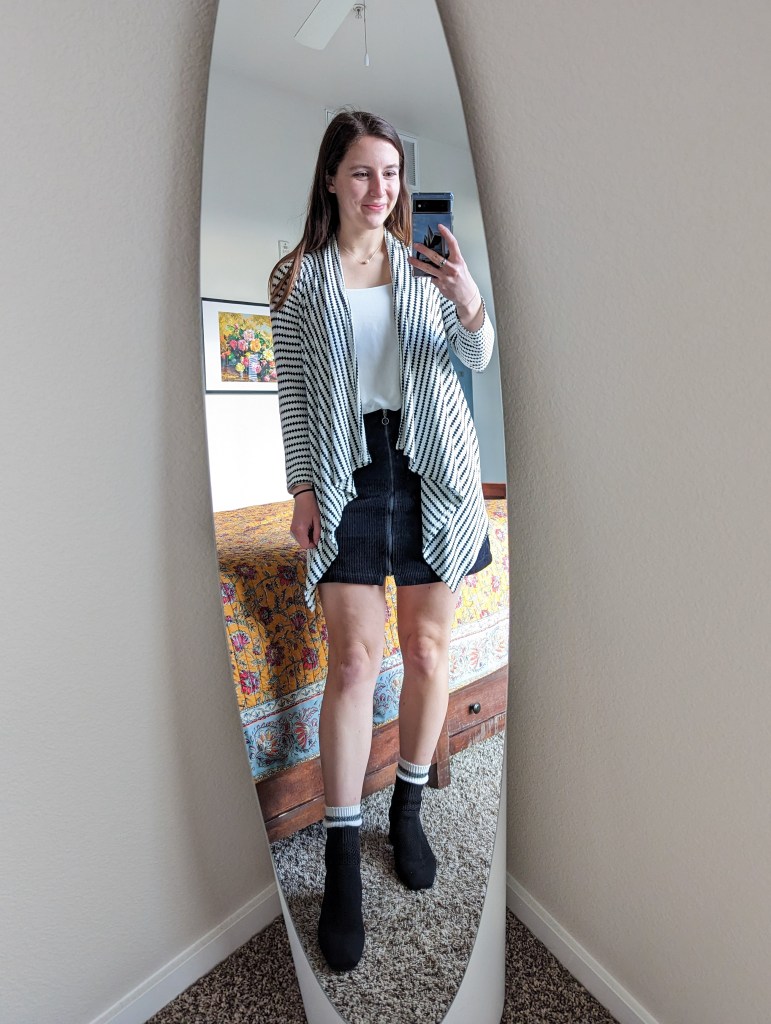 white-blouse-black-corduroy-skirt-geometric-cardigan-black-booties