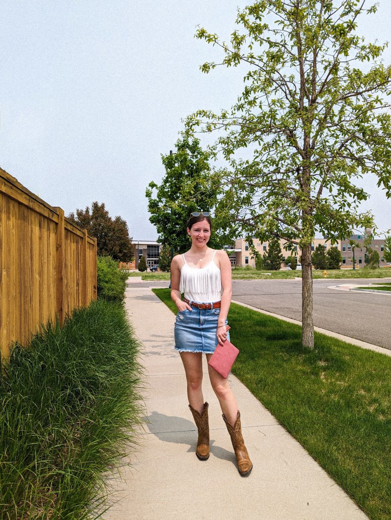 summer-style-fringe-bodysuit-denim-skirt-cowgirl-boots-sungait-glasses