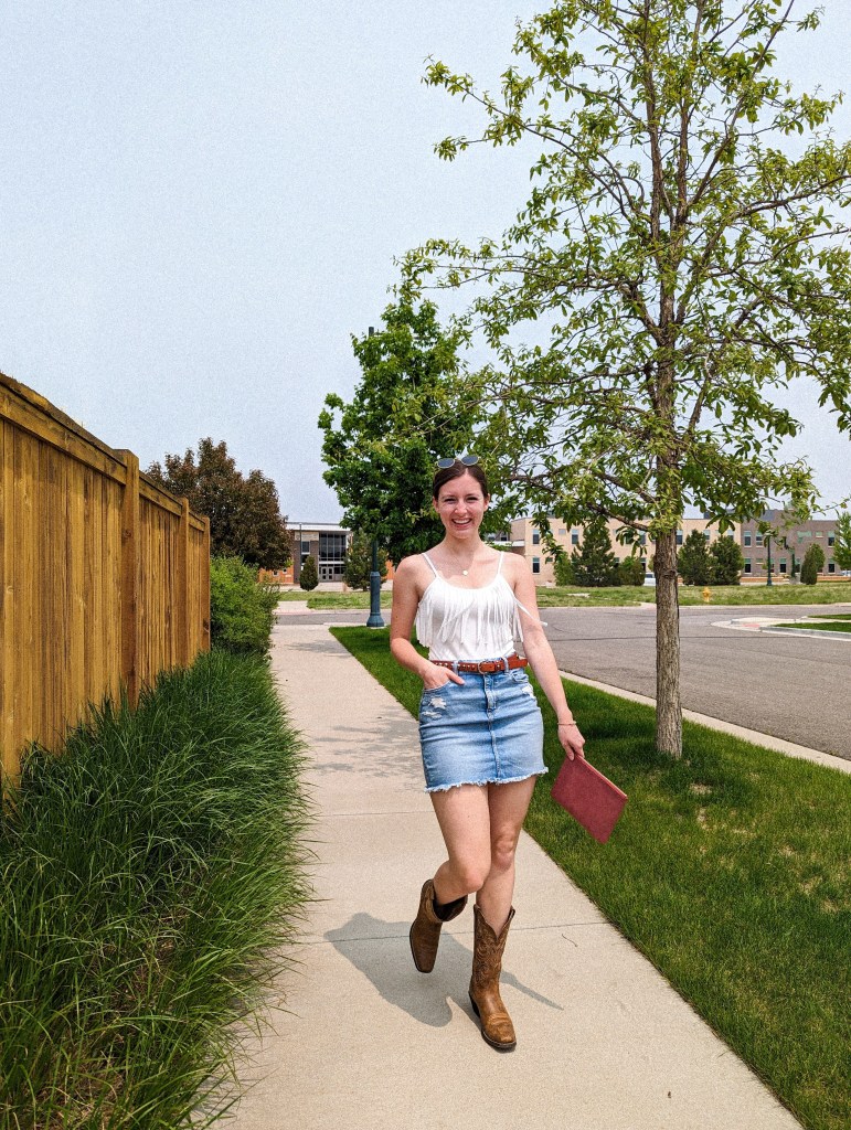 white-fringe-bodysuit-cavenders-denim-skirt-american-eagle-cowgirl-boots-ariat-boot-barn