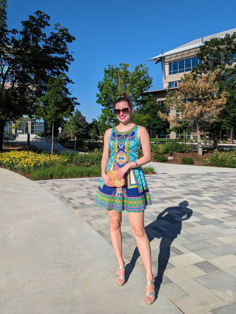 printed-dress-orange-beaded-clutch-geometric-pattern-gold-wedges