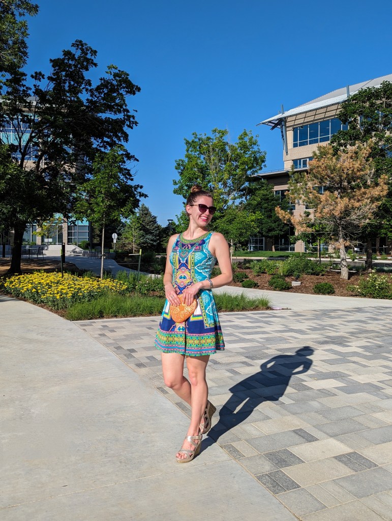 orange-purse-geometric-dress-fit-and-flare-gold-wedges-black-sunglasses